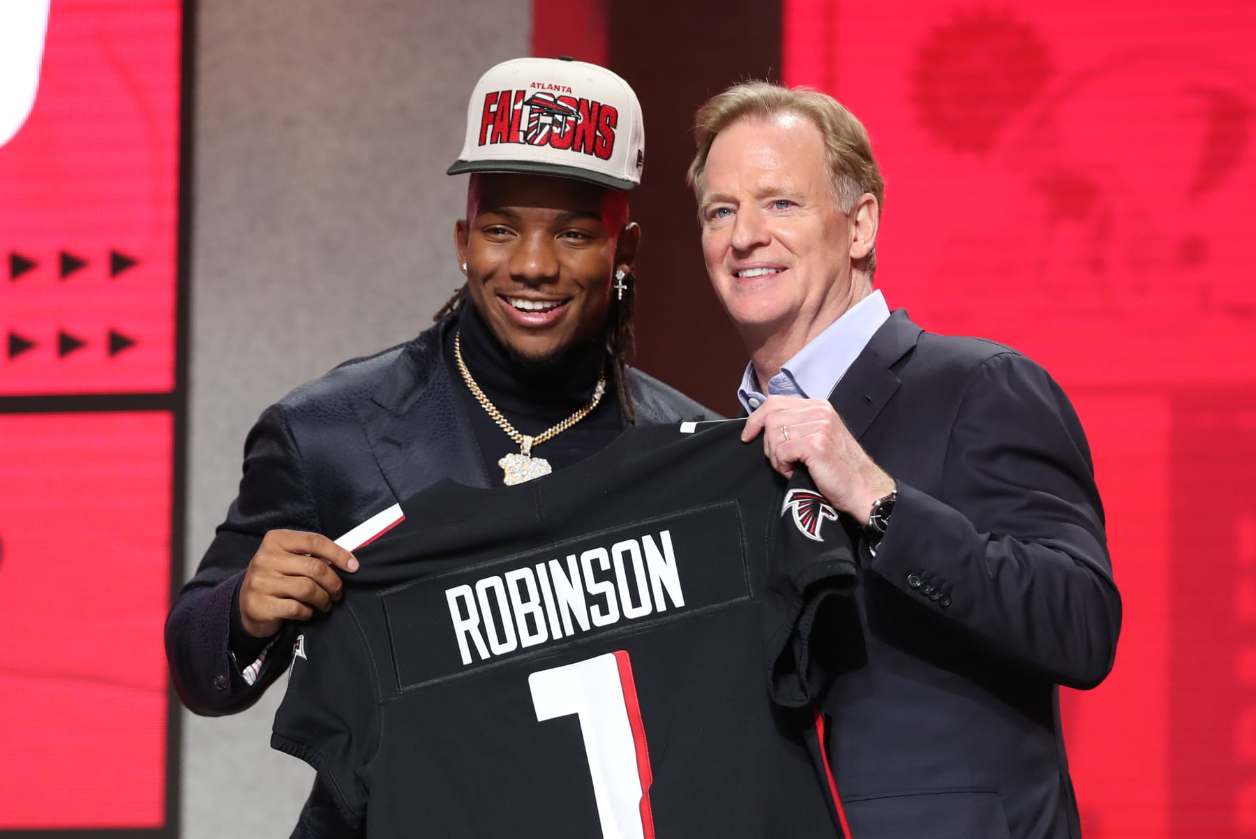 KANSAS CITY, MO - APRIL 27: Texas running back Bijan Robinson holds a jersey with commission Roger Goodell after being drafted in the first round of the NFL Draft on April 27, 2023 at Union Station in Kansas City, MO. (Photo by Scott Winters/Icon Sportswire via Getty Images)