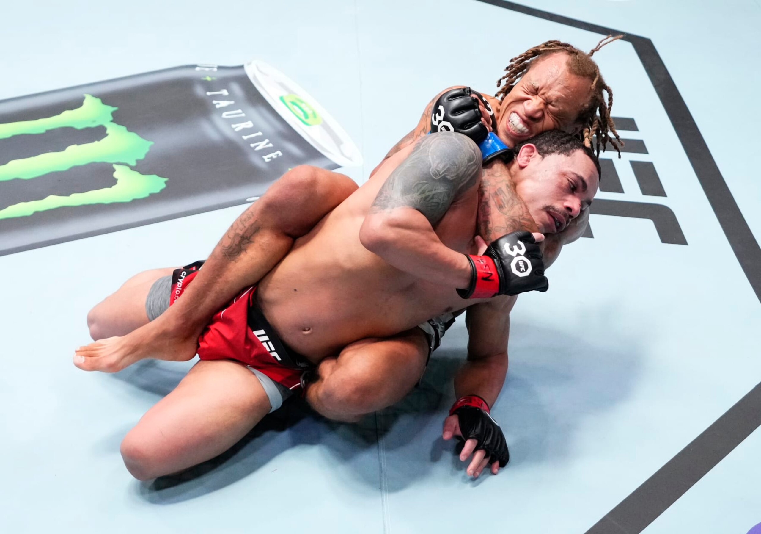 LAS VEGAS, NEVADA - APRIL 29: (L-R) Marcus McGhee secures a rear choke submission against Journey Newson in a bantamweight fight during the UFC Fight Night event at UFC APEX on April 29, 2023 in Las Vegas, Nevada. (Photo by Jeff Bottari/Zuffa LLC via Getty Images)