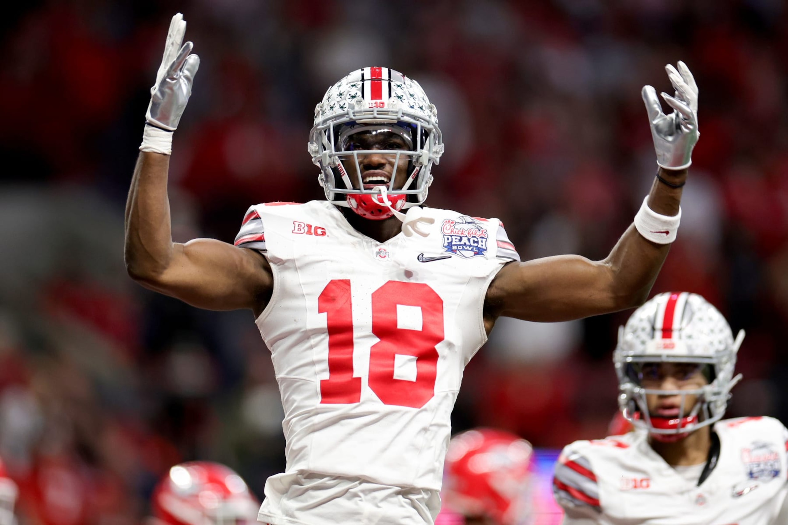 ATLANTA, GEORGIA - DECEMBER 31: Marvin Harrison Jr. #18 of the Ohio State Buckeyes reacts after a touchdown during the first quarter in the Chick-fil-A Peach Bowl at Mercedes-Benz Stadium on December 31, 2022 in Atlanta, Georgia. (Photo by Carmen Mandato/Getty Images)