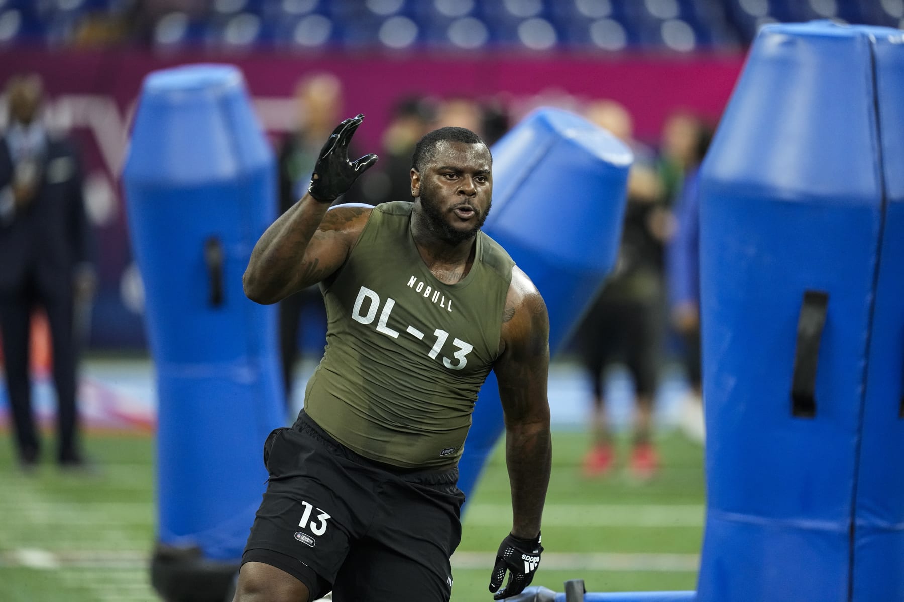 Oklahoma defensive lineman Jalen Redmond runs a drill at the NFL football scouting combine in Indianapolis, Thursday, March 2, 2023. (AP Photo/Darron Cummings)