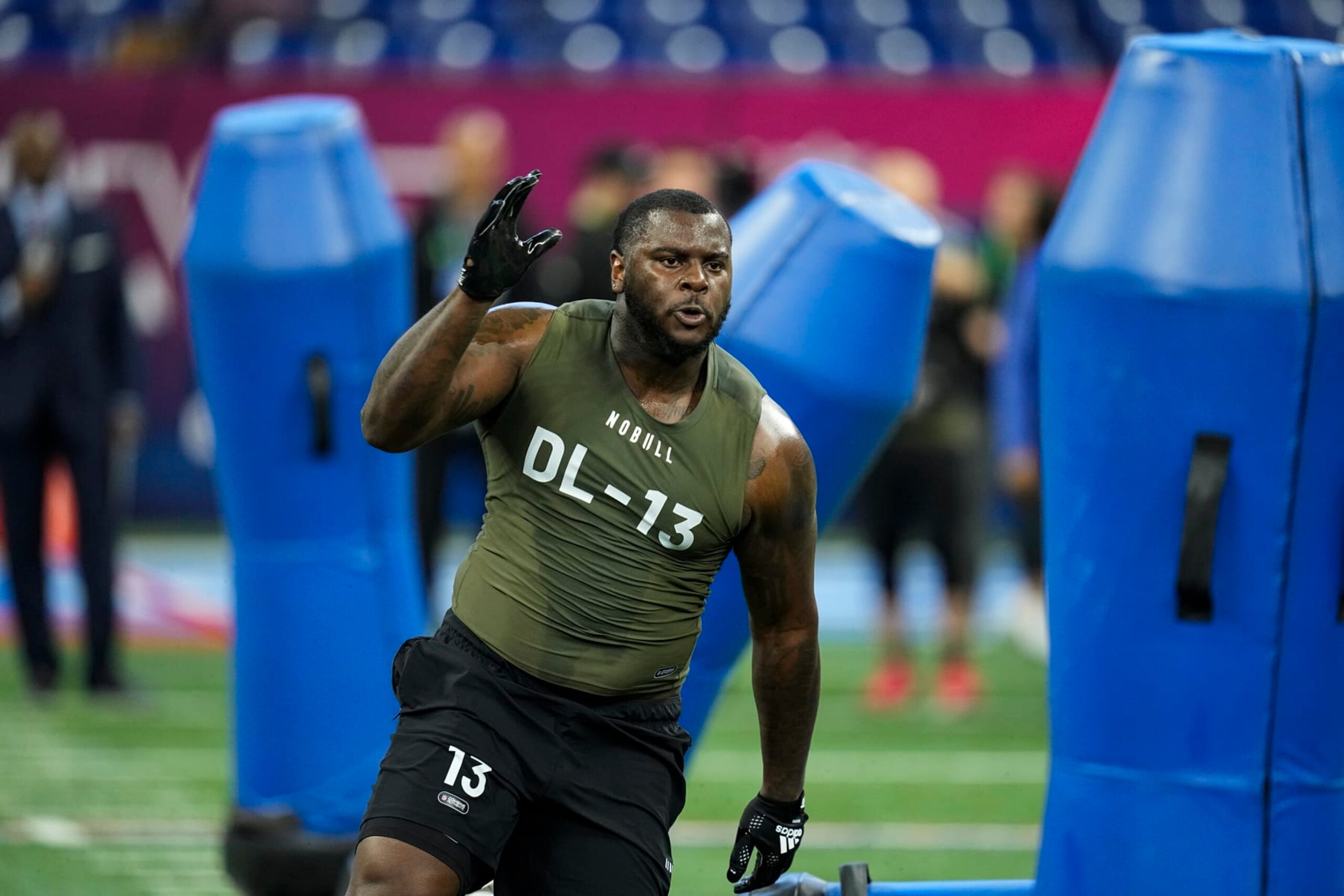 Oklahoma defensive lineman Jalen Redmond runs a drill at the NFL football scouting combine in Indianapolis, Thursday, March 2, 2023. (AP Photo/Darron Cummings)