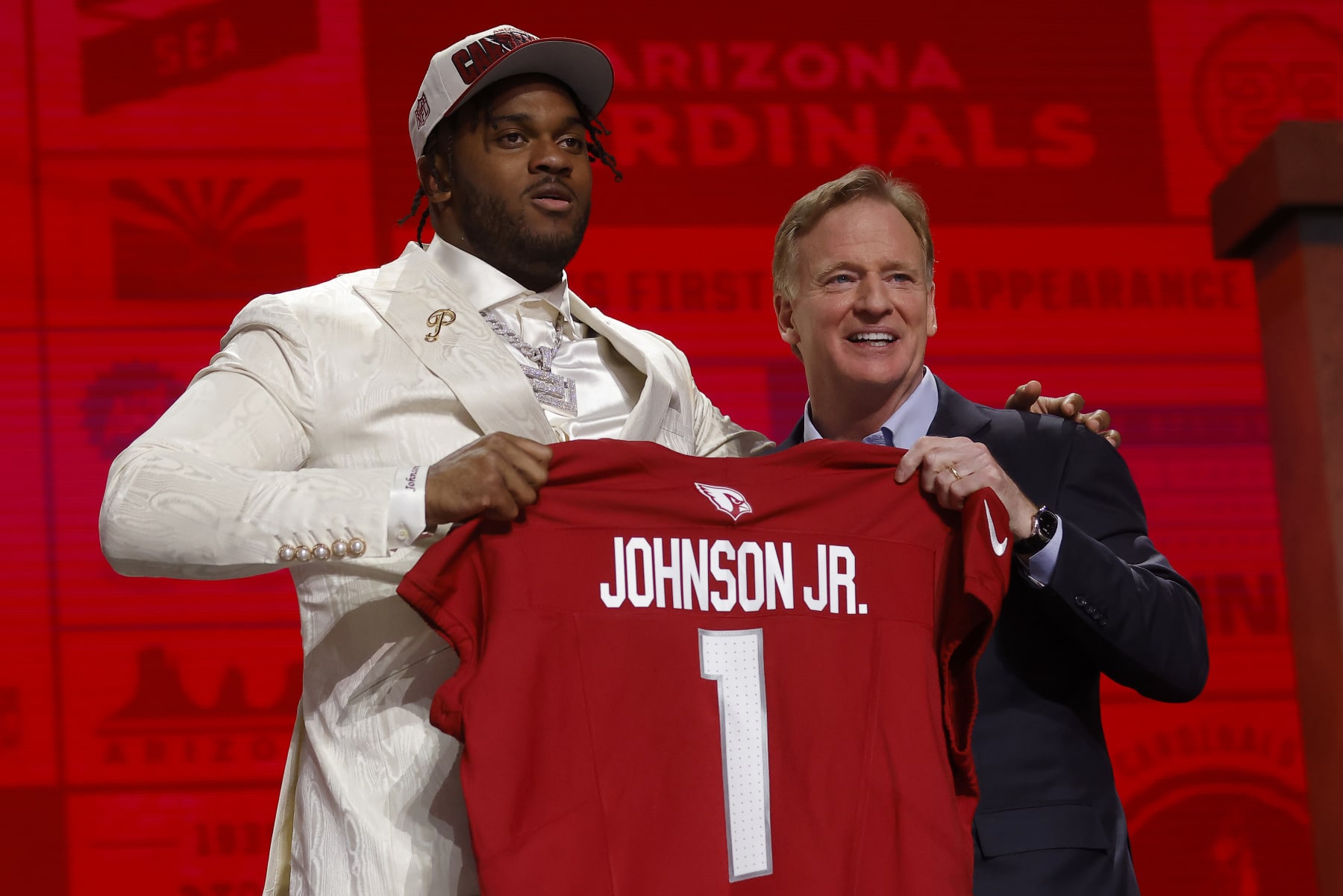 KANSAS CITY, MISSOURI - APRIL 27: (L-R) Paris Johnson Jr. poses with NFL Commissioner Roger Goodell after being selected sixth overall by the Arizona Cardinals during the first round of the 2023 NFL Draft at Union Station on April 27, 2023 in Kansas City, Missouri. (Photo by David Eulitt/Getty Images)