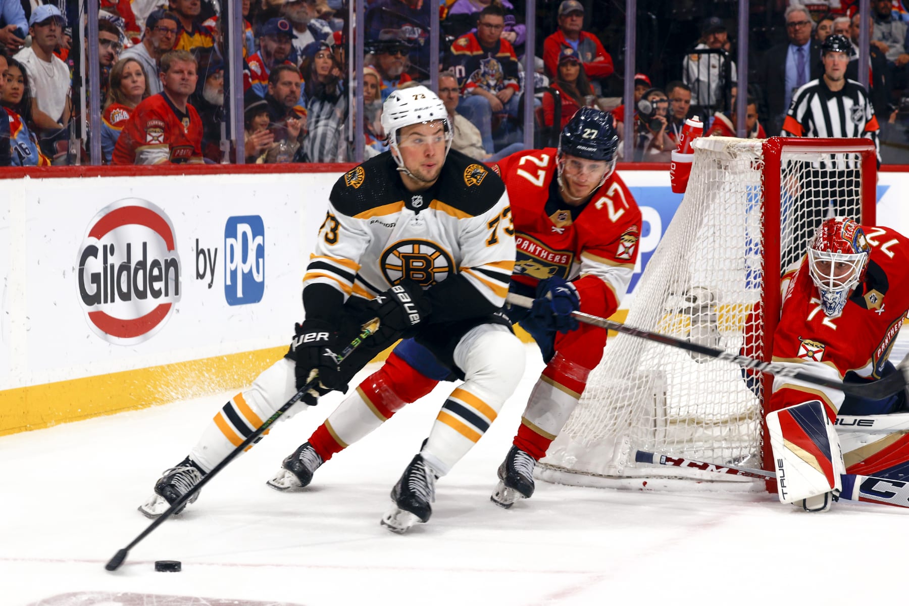 SUNRISE, FL - APRIL 28: Eetu Luostarinen #27 of the Florida Panthers defends against Charlie McAvoy #73 of the Boston Bruins as eh circles behind the net with the puck  in Game Six of the First Round of the 2023 Stanley Cup Playoffs at the FLA Live Arena on April 28, 2023 in Sunrise, Florida. (Photo by Joel Auerbach/Getty Images)
