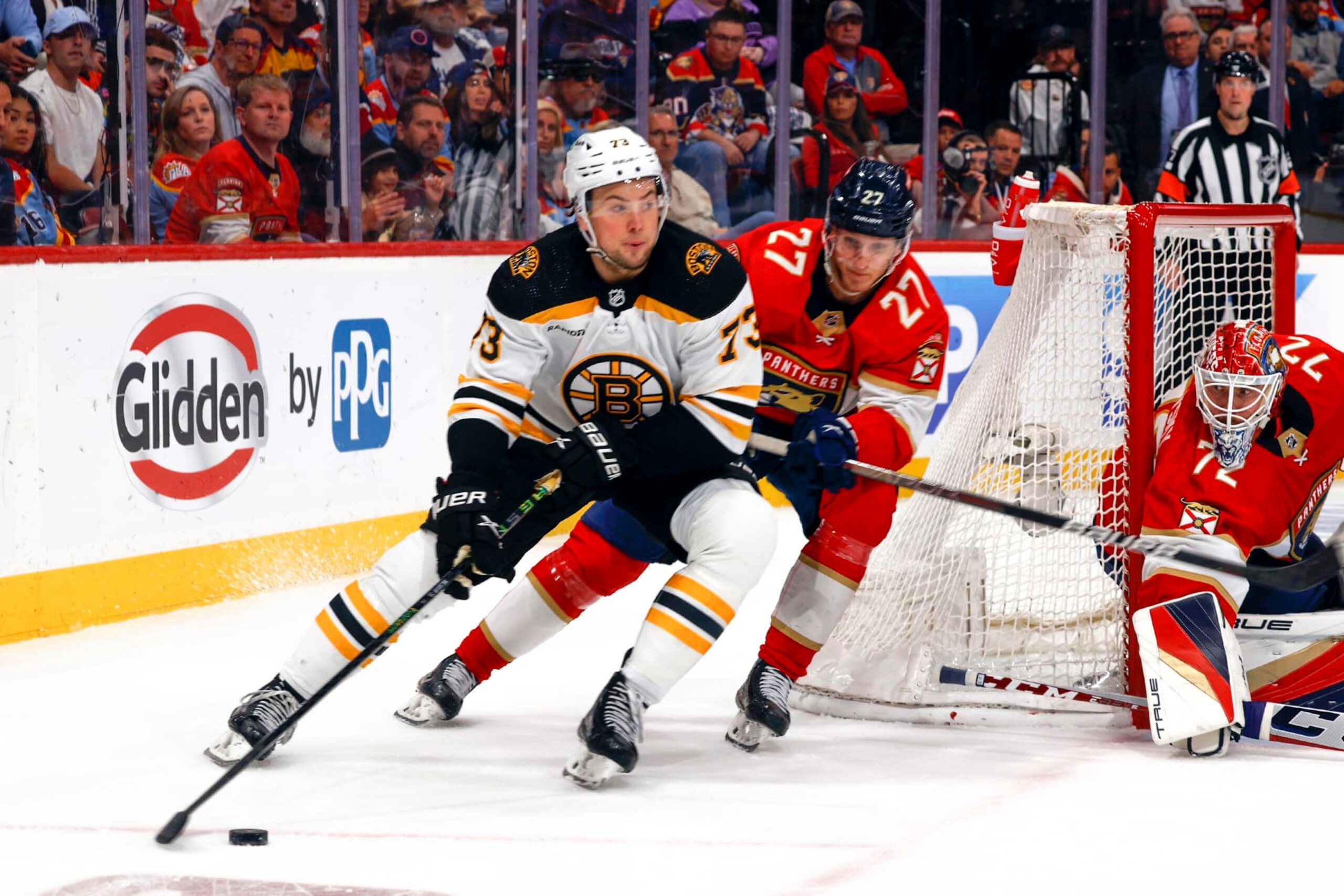 SUNRISE, FL - APRIL 28: Eetu Luostarinen #27 of the Florida Panthers defends against Charlie McAvoy #73 of the Boston Bruins as eh circles behind the net with the puck  in Game Six of the First Round of the 2023 Stanley Cup Playoffs at the FLA Live Arena on April 28, 2023 in Sunrise, Florida. (Photo by Joel Auerbach/Getty Images)