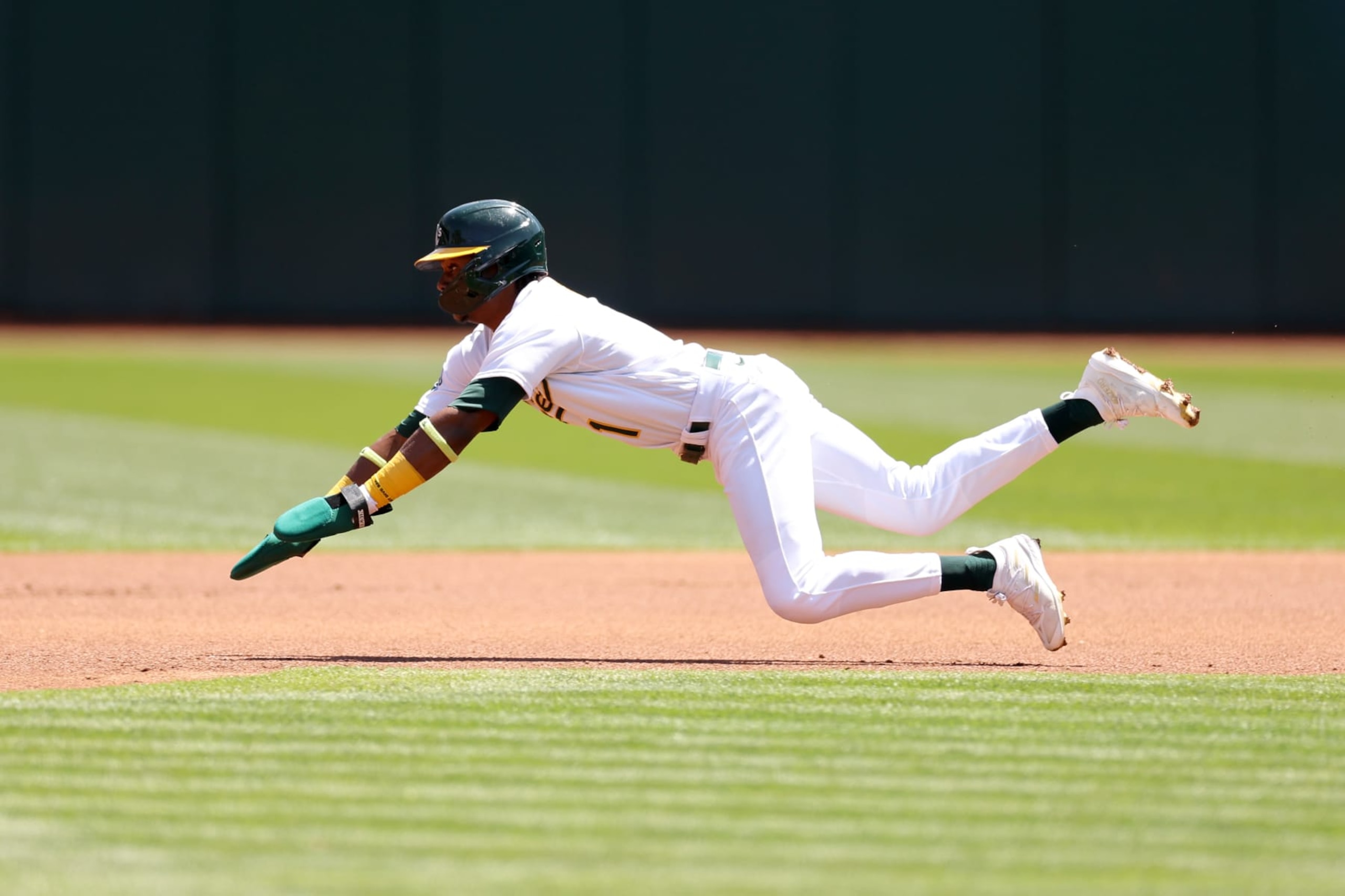 OAKLAND, CALIFORNIA - APRIL 19: Esteury Ruiz #1 of the Oakland Athletics slides into second base against the Chicago Cubs at RingCentral Coliseum on April 19, 2023 in Oakland, California. (Photo by Ezra Shaw/Getty Images)