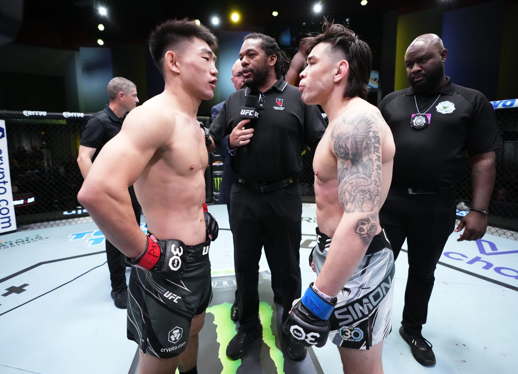 LAS VEGAS, NEVADA - APRIL 29: (L-R) Opponents Song Yadong of China and Ricky Simon face off prior to their bantamweight fight during the UFC Fight Night event at UFC APEX on April 29, 2023 in Las Vegas, Nevada. (Photo by Jeff Bottari/Zuffa LLC via Getty Images)
