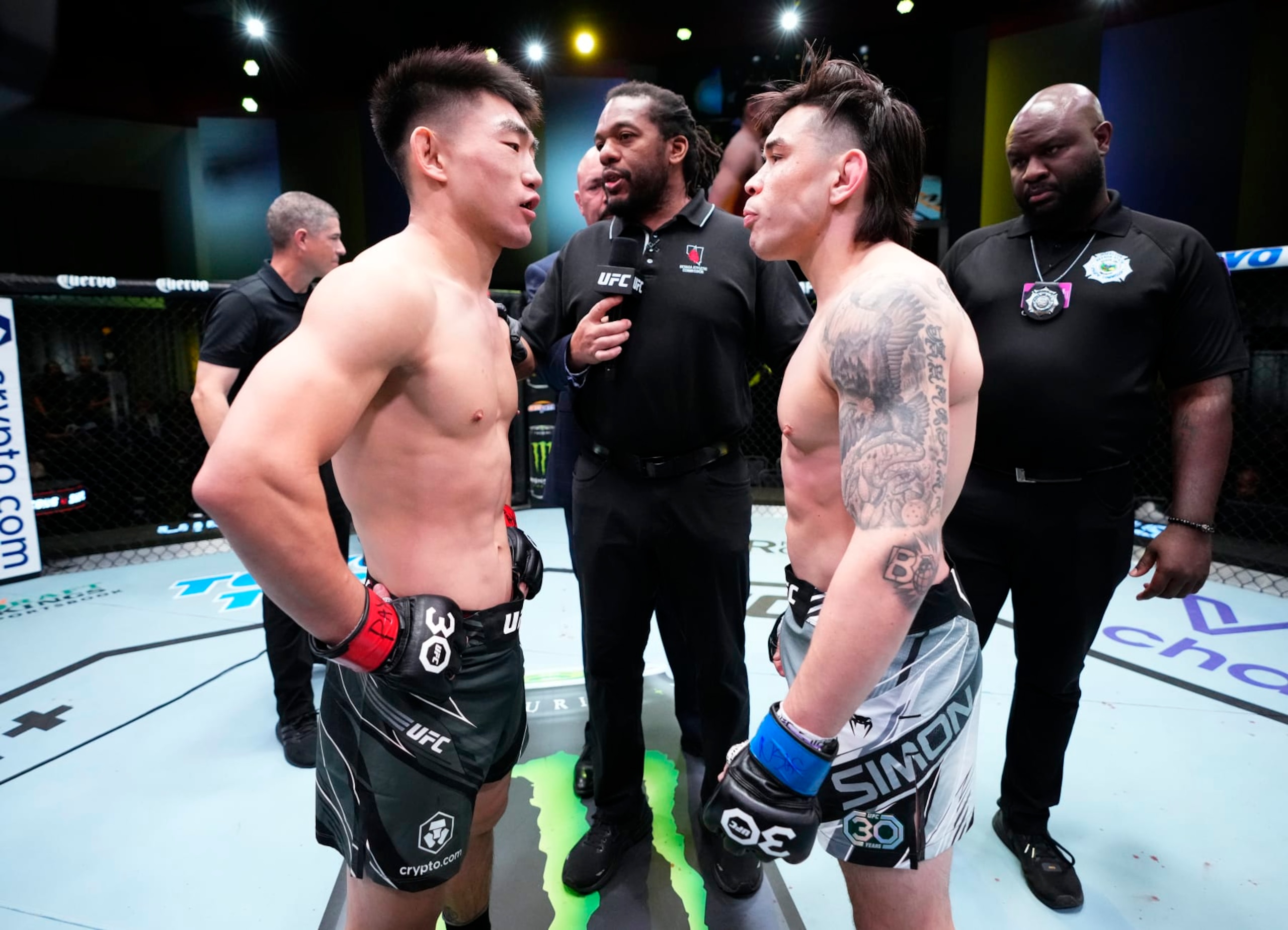 LAS VEGAS, NEVADA - APRIL 29: (L-R) Opponents Song Yadong of China and Ricky Simon face off prior to their bantamweight fight during the UFC Fight Night event at UFC APEX on April 29, 2023 in Las Vegas, Nevada. (Photo by Jeff Bottari/Zuffa LLC via Getty Images)