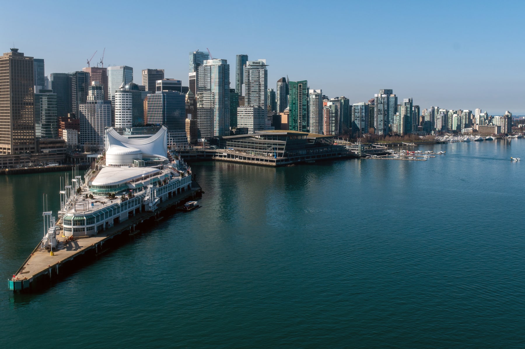 The Vancouver skyline and cruise ship terminal, left, in Vancouver, British Columbia, Canada, on Wednesday, March 22, 2023. Canada is scheduled to release gross domestic product (GDP) figures on March 31. Photographer: James MacDonald/Bloomberg via Getty Images