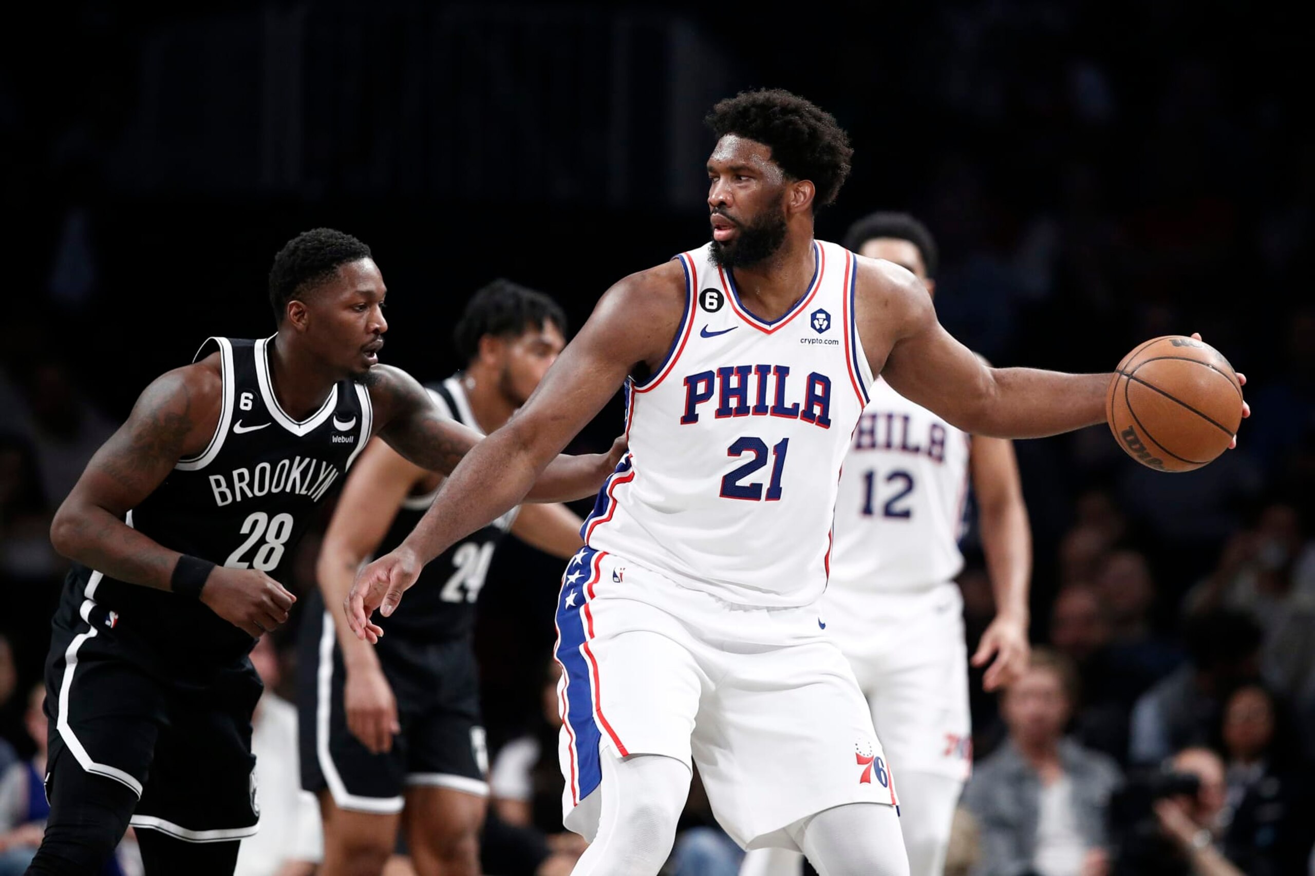 NEW YORK, NEW YORK - APRIL 20: Joel Embiid #21 of the Philadelphia 76ers dribbles against Dorian Finney-Smith #28 of the Brooklyn Nets during the first half of Game Three of the Eastern Conference First Round Playoffs at Barclays Center on April 20, 2023 in the Brooklyn borough of New York City. NOTE TO USER: User expressly acknowledges and agrees that, by downloading and or using this photograph, User is consenting to the terms and conditions of the Getty Images License Agreement. (Photo by Sarah Stier/Getty Images)