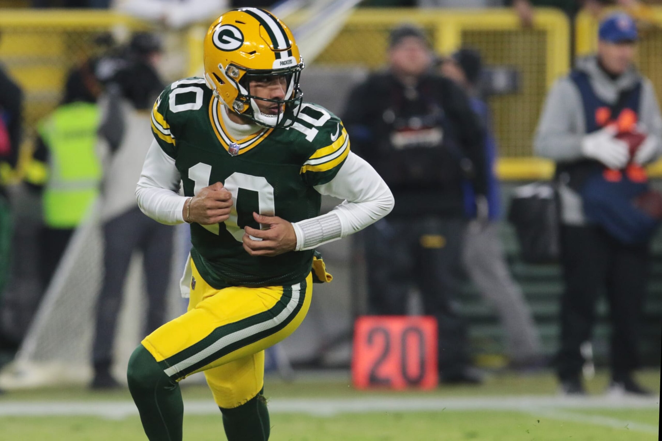 GREEN BAY, WI - JANUARY 01: Green Bay Packers quarterback Jordan Love (10) rolls out during a game between the Green Bay Packers and the Minnesota Vikings on January 1, 2023 at Lambeau Field in Green Bay, WI. (Photo by Larry Radloff/Icon Sportswire via Getty Images)