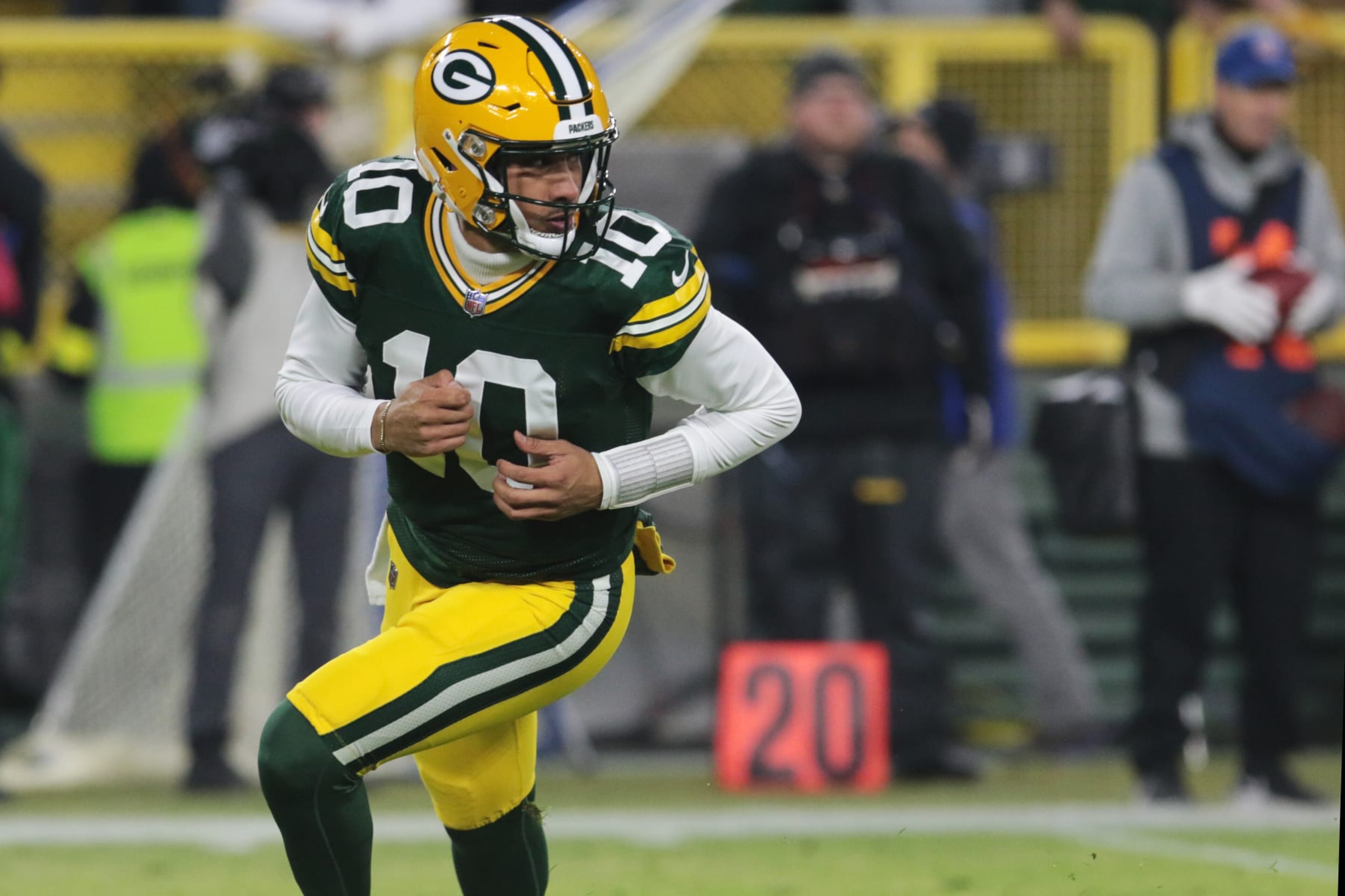 GREEN BAY, WI - JANUARY 01: Green Bay Packers quarterback Jordan Love (10) rolls out during a game between the Green Bay Packers and the Minnesota Vikings on January 1, 2023 at Lambeau Field in Green Bay, WI. (Photo by Larry Radloff/Icon Sportswire via Getty Images)