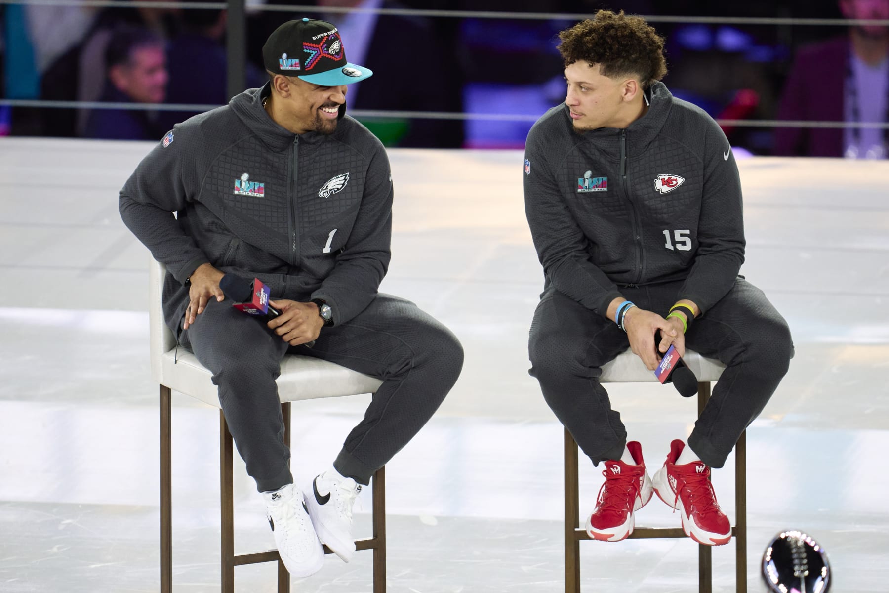 PHOENIX, AZ - FEBRUARY 06: Jalen Hurts #1 of the Philadelphia Eagles speaks with Patrick Mahomes #15 of the Kansas City Chiefs at Footprint Center on February 6, 2023 in Phoenix, Arizona. (Photo by Cooper Neill/Getty Images)