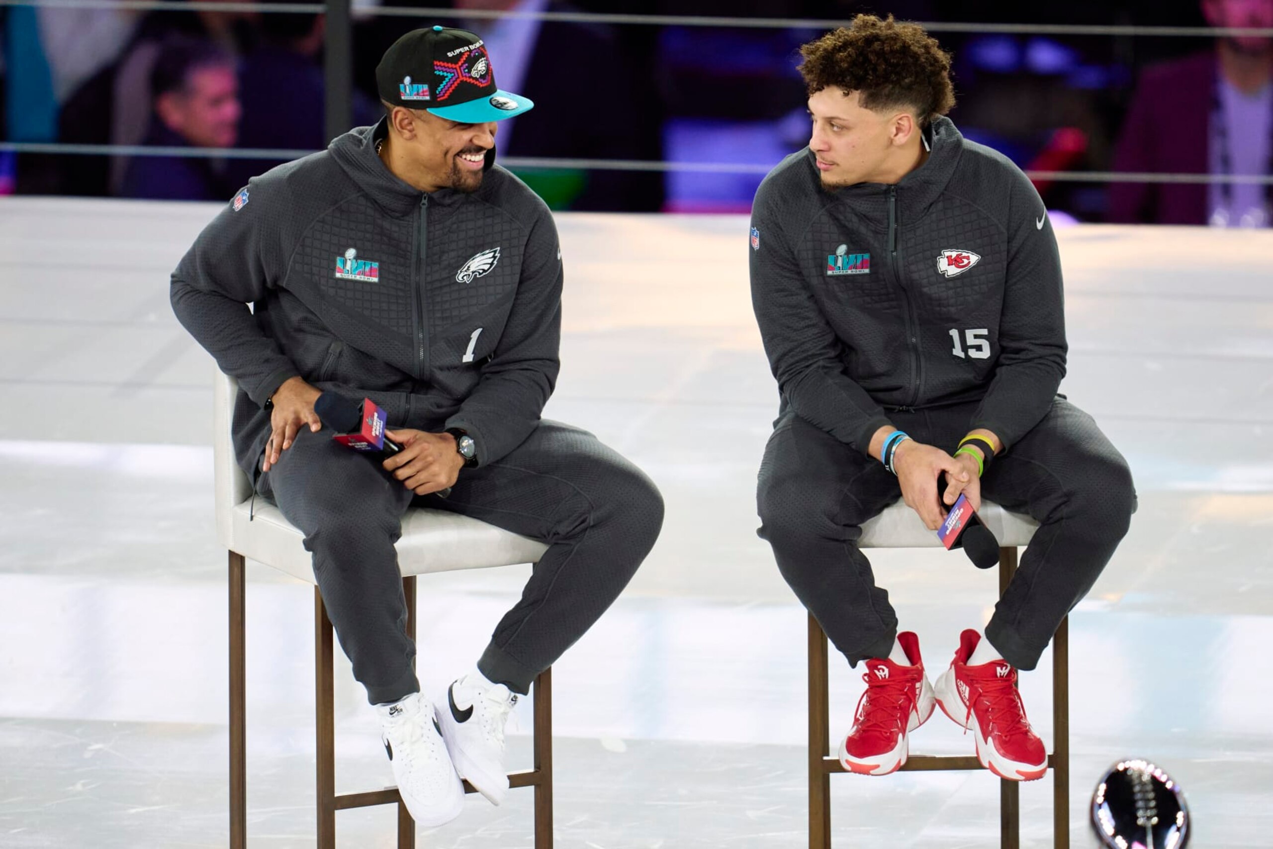 PHOENIX, AZ - FEBRUARY 06: Jalen Hurts #1 of the Philadelphia Eagles speaks with Patrick Mahomes #15 of the Kansas City Chiefs at Footprint Center on February 6, 2023 in Phoenix, Arizona. (Photo by Cooper Neill/Getty Images)