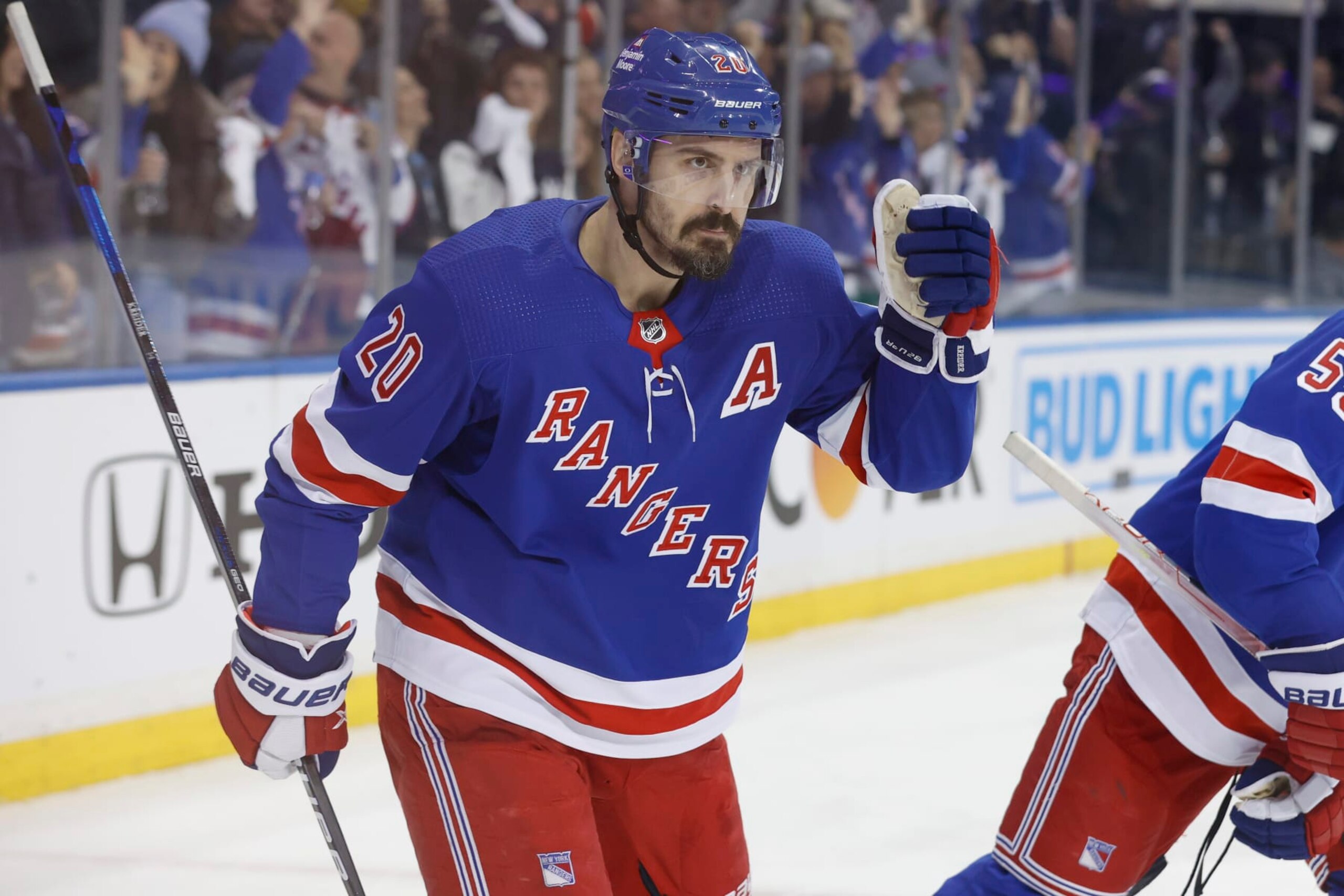 NEW YORK, NEW YORK - APRIL 29: Chris Kreider #20 of the New York Rangers pumps his fist after Mika Zibanejad #93 scores a goal against the New Jersey Devils during the third period in Game Six of the First Round of the 2023 Stanley Cup Playoffs at Madison Square Garden on April 29, 2023 in New York, New York. (Photo by Josh Lobel/NHLI via Getty Images)
