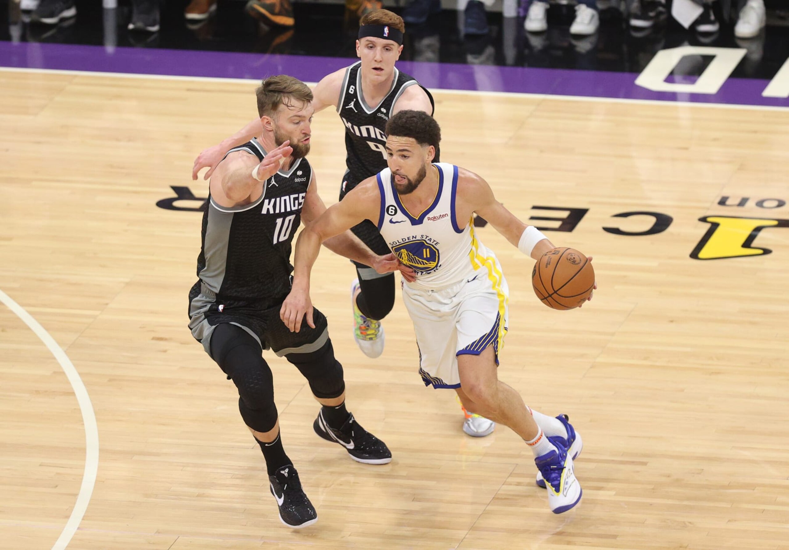 SACRAMENTO, CALIFORNIA - APRIL 30: Klay Thompson #11 of the Golden State Warriors dribbles against Domantas Sabonis #10 of the Sacramento Kings during the first quarter in game seven of the Western Conference First Round Playoffs at Golden 1 Center on April 30, 2023 in Sacramento, California. NOTE TO USER: User expressly acknowledges and agrees that, by downloading and or using this photograph, User is consenting to the terms and conditions of the Getty Images License Agreement. (Photo by Ezra Shaw/Getty Images)