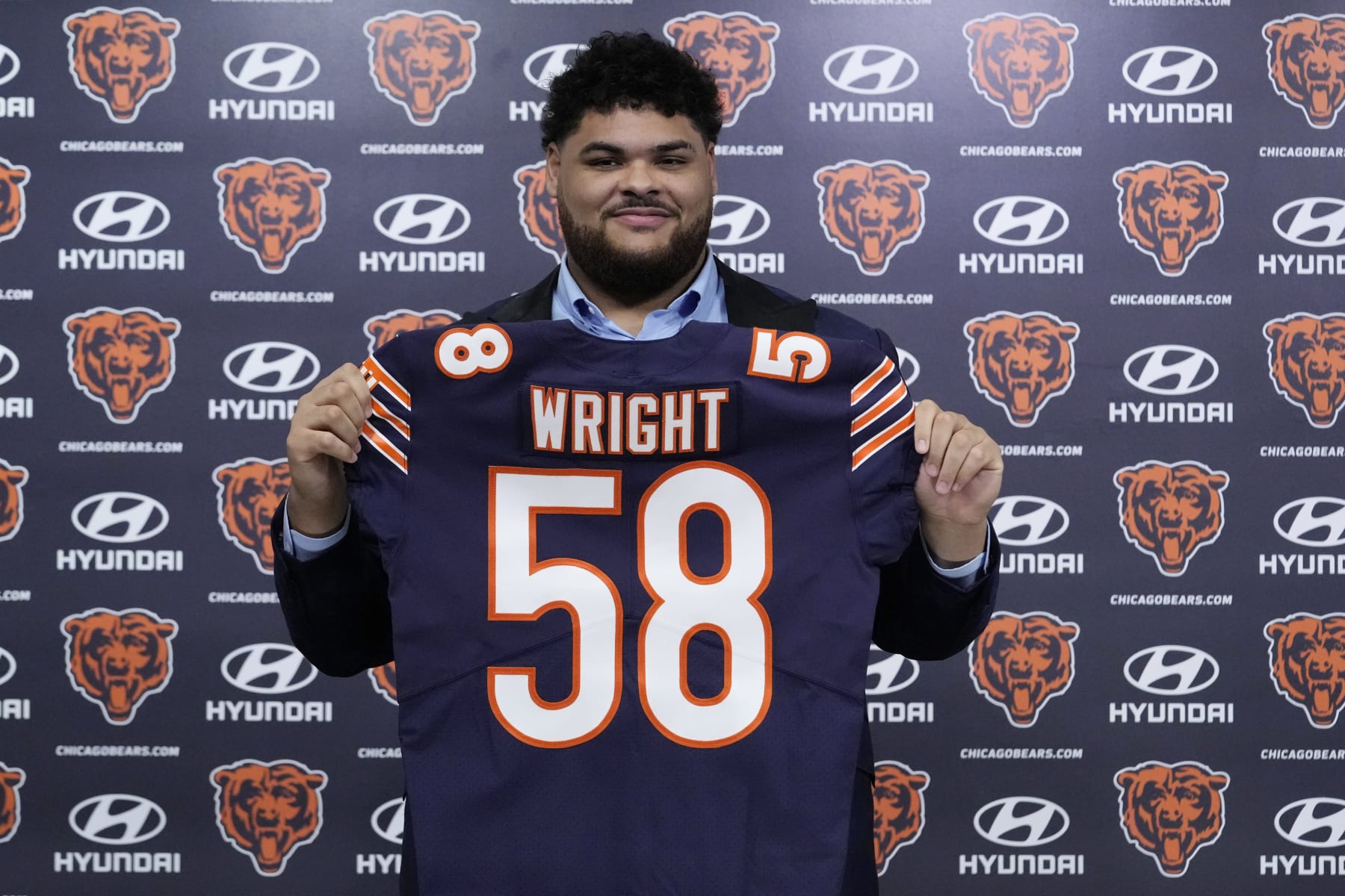 Chicago Bears number one draft pick offensive lineman Darnell Wright poses with his jersey at a news conference at Halas Hall in Lake Forest, Ill., Friday, April 28, 2023. The Chicago Bears selected offensive lineman Darnell Wright with the 10th overall pick in the first round of the 2023 NFL Draft on Thursday evening. The Bears acquired the 10th overall selection after completing a pair of trades with the Carolina Panthers on March 15, and the Philadelphia Eagles on Thursday night. (AP Photo/Nam Y. Huh)