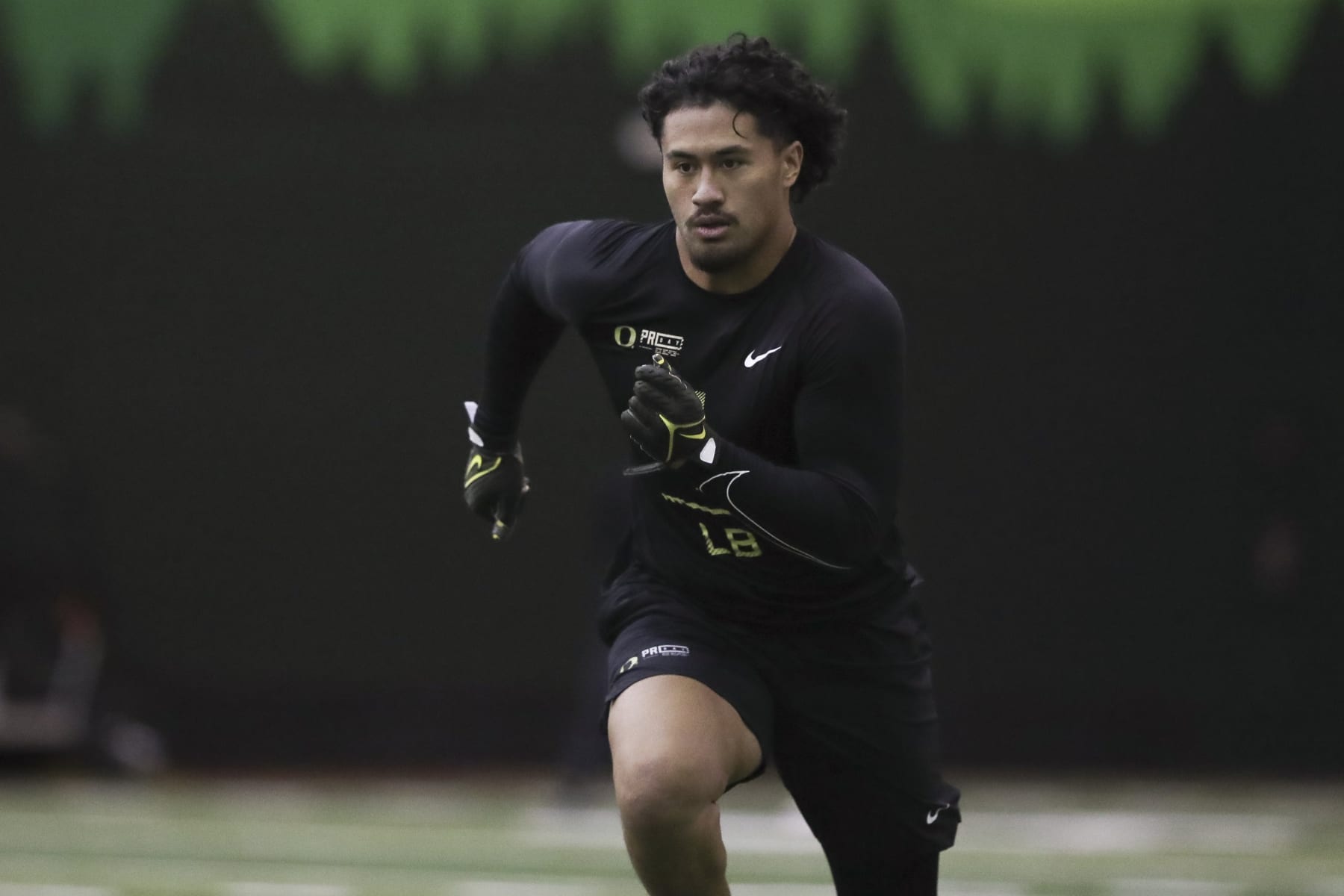 Oregon football player Noah Sewell (1) participates in a position drill at the school's NFL Pro Day, Tuesday, March 14, 2023, in Eugene, Ore. (AP Photo/Amanda Loman)