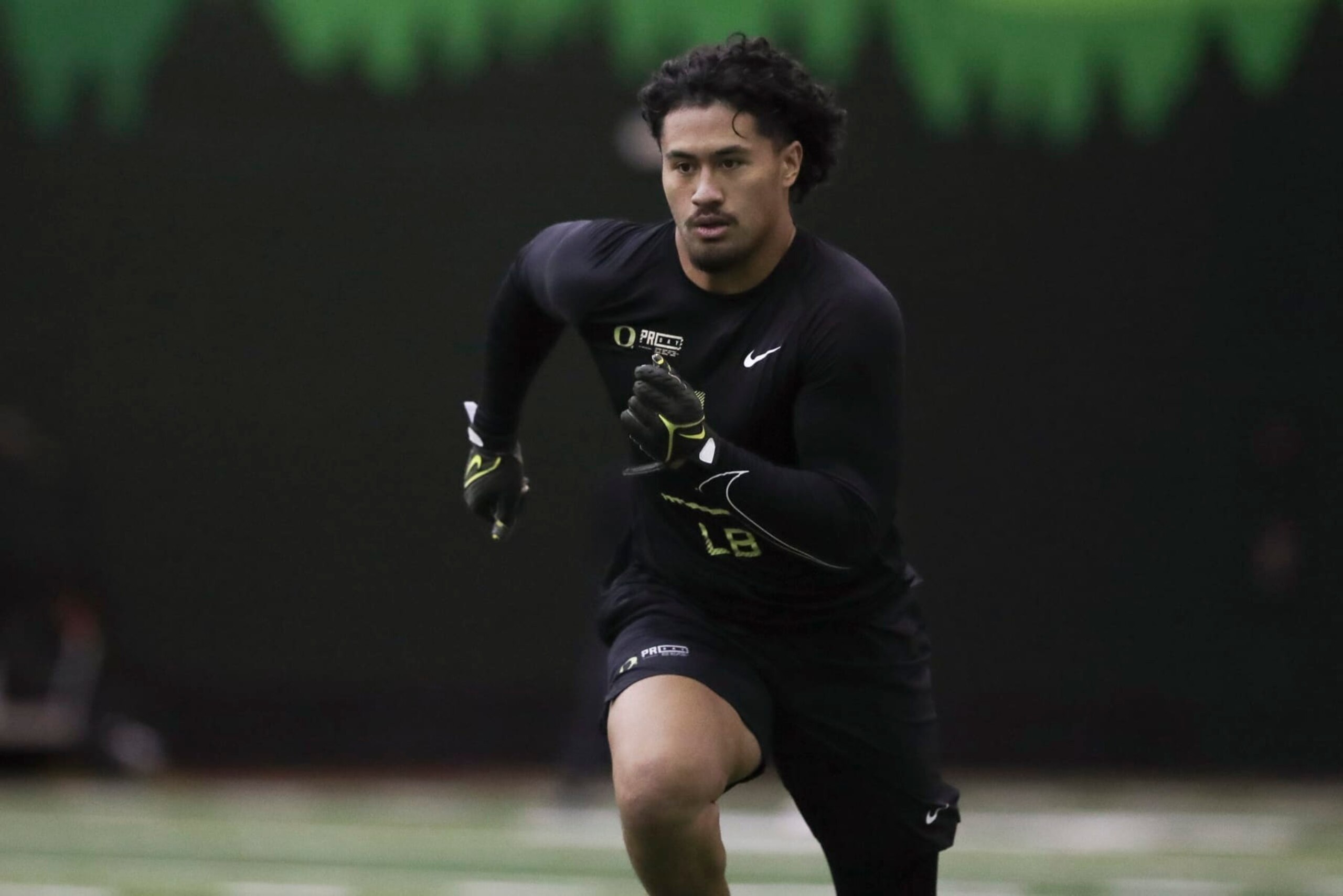 Oregon football player Noah Sewell (1) participates in a position drill at the school's NFL Pro Day, Tuesday, March 14, 2023, in Eugene, Ore. (AP Photo/Amanda Loman)