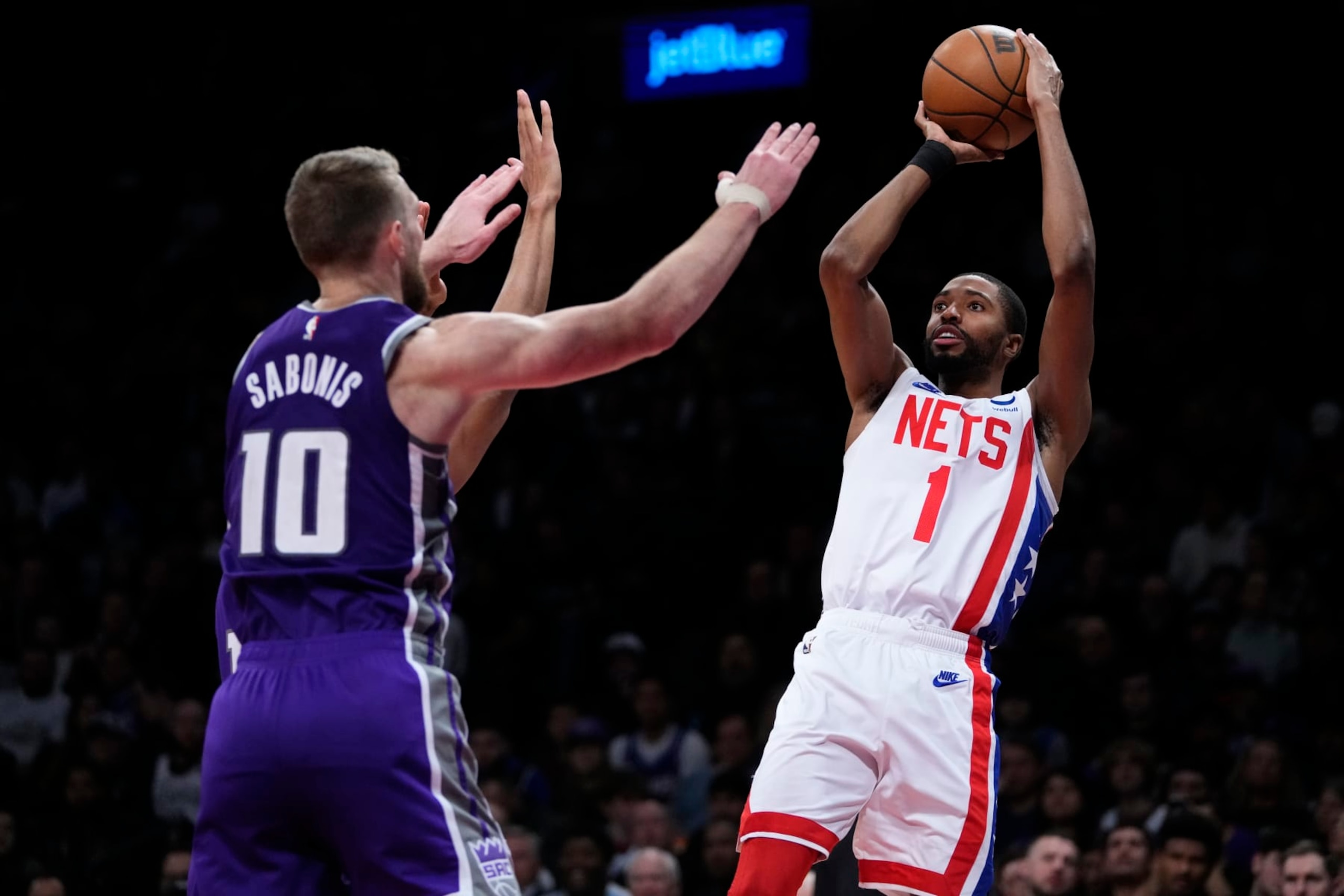 Brooklyn Nets' Mikal Bridges (1) shoots over Sacramento Kings' Domantas Sabonis (10) during the second half of an NBA basketball game Thursday, March 16, 2023, in New York. The Kings won 101-96. (AP Photo/Frank Franklin II)
