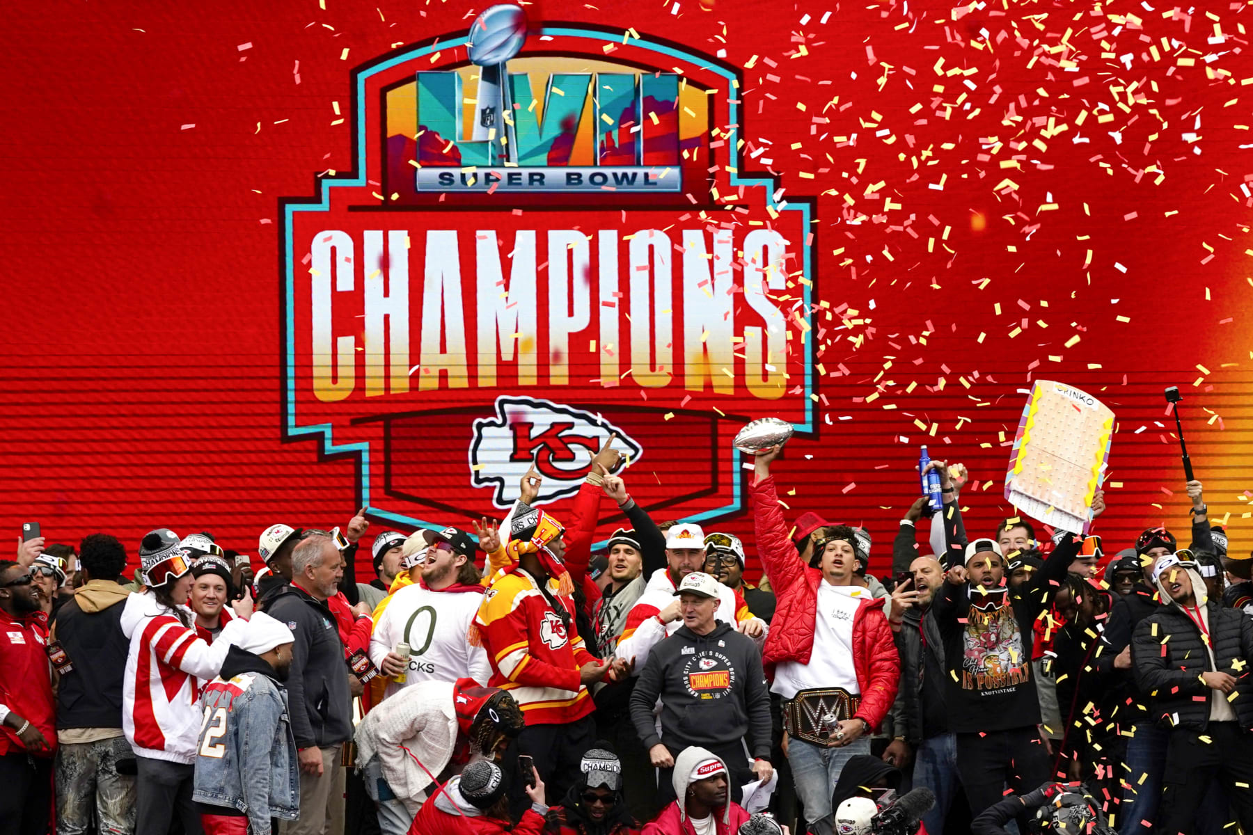 KANSAS CITY, MISSOURI - FEBRUARY 15: Patrick Mahomes #15 of the Kansas City Chiefs holds up the MVP trophy while celebrating with teammates during the Kansas City Chiefs Super Bowl LVII victory parade on February 15, 2023 in Kansas City, Missouri. (Photo by Jay Biggerstaff/Getty Images)