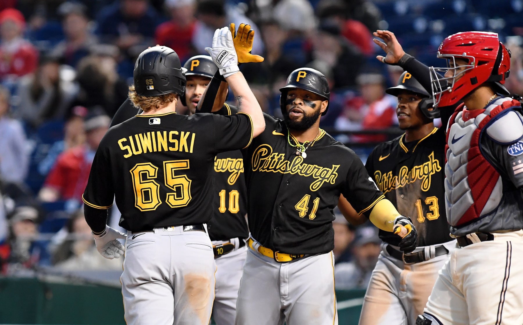 WASHINGTON, DC - APRIL 29: Pittsburgh Pirates left fielder Bryan Reynolds (10), first baseman Carlos Santana (41), and third baseman Ke'Bryan Hayes (13) celebrate with center fielder Jack Suwinski (65) after his 6th inning grand slam home run during the Pittsburgh Pirates versus Washington Nationals MLB game 2 at Nationals Park on April 29, 2023 in Washington, D.C.. (Photo by Randy Litzinger/Icon Sportswire via Getty Images)