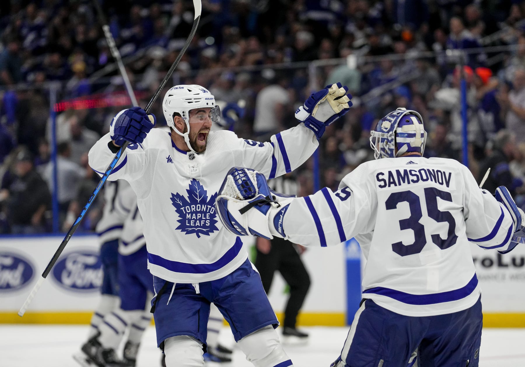 TAMPA, FL - APRIL 29: Toronto Maple Leafs defenseman Erik Gustafsson (56) and Toronto Maple Leafs goaltender Ilya Samsonov (35) celebrate winning and advancing to the 2nd round as Toronto Maple Leafs shake the Jinx during Game Six of the First Round of the 2023 Stanley Cup Playoffs between the Tampa Bay Lightning and Toronto Maple Leafs on April 29th 2023 at Amalie Arena in Tampa, FL. (Photo by Andrew Bershaw/Icon Sportswire via Getty Images)