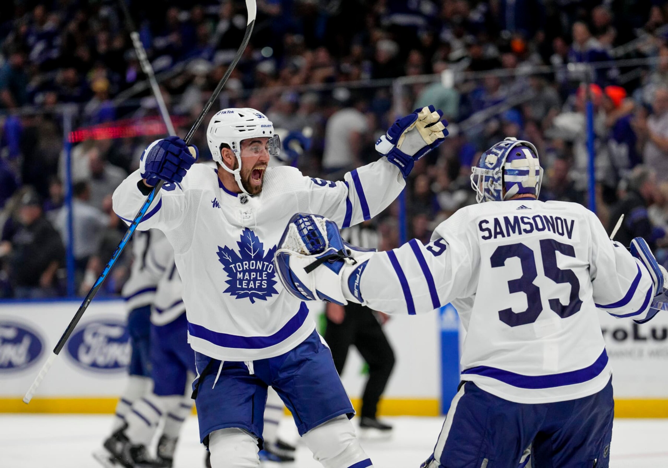 TAMPA, FL - APRIL 29: Toronto Maple Leafs defenseman Erik Gustafsson (56) and Toronto Maple Leafs goaltender Ilya Samsonov (35) celebrate winning and advancing to the 2nd round as Toronto Maple Leafs shake the Jinx during Game Six of the First Round of the 2023 Stanley Cup Playoffs between the Tampa Bay Lightning and Toronto Maple Leafs on April 29th 2023 at Amalie Arena in Tampa, FL. (Photo by Andrew Bershaw/Icon Sportswire via Getty Images)
