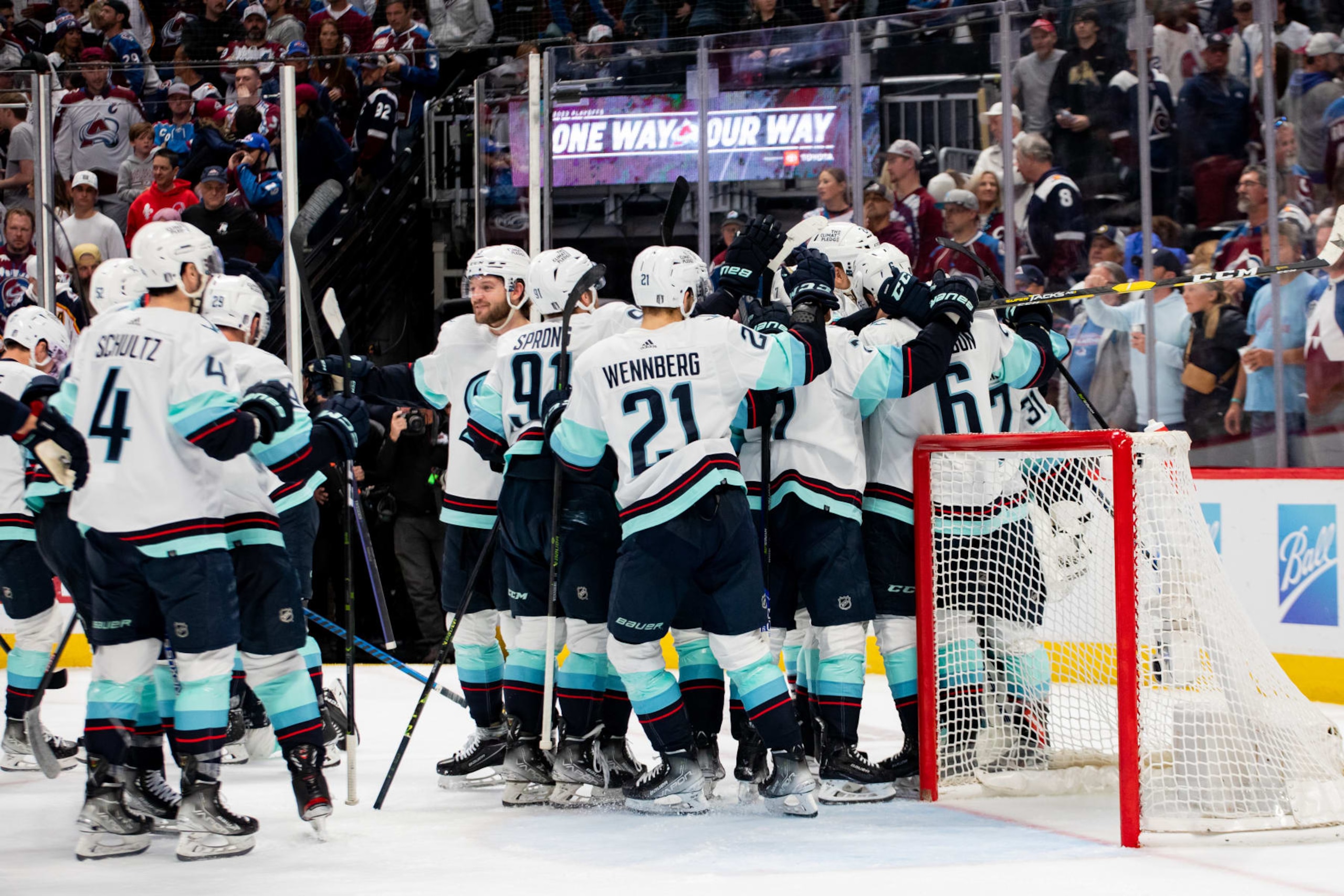 DENVER, COLORADO - APRIL 30: The Seattle Kraken swarm goaltender Philipp Grubauer after the Kraken defeated the Colorado Avalanche 2-1 in Game Seven of the First Round of the 2023 Stanley Cup Playoffs at Ball Arena on April 30, 2023 in Denver, Colorado. (Photo by Ashley Potts/NHLI via Getty Images)