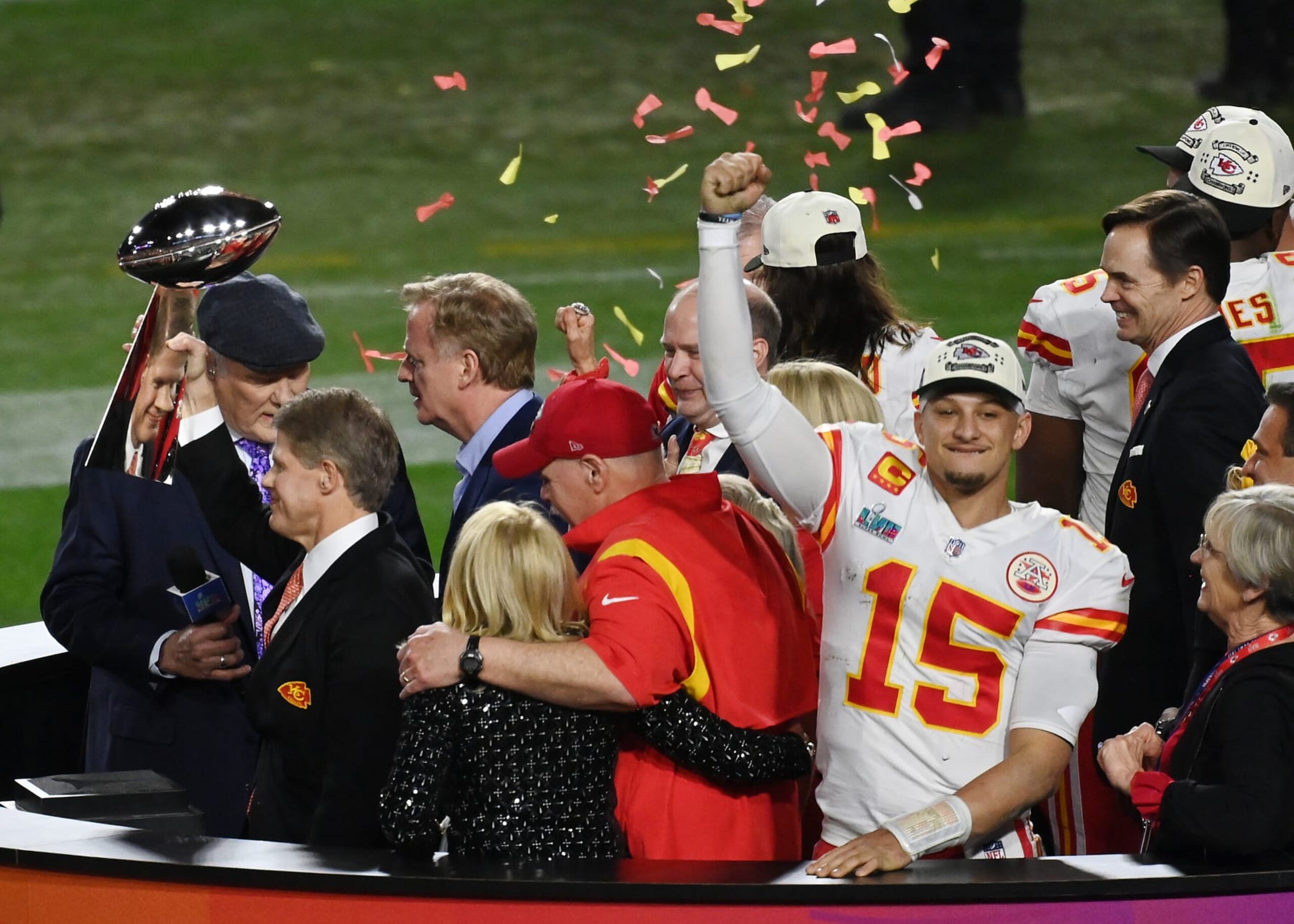 GLENDALE, ARIZONA - FEBRUARY 12: Head coach Andy Reid and quarter back Patrick Mahomes #15 of the Kansas City Chiefs stands on the podium with owner Clark Hunt celebrating with the Lombardi Trophy after they defeated the Philadelphia Eagles 38-35 in Super Bowl LVII at State Farm Stadium on February 12, 2023 in Glendale, Arizona. (Photo by Focus on Sport/Getty Images)