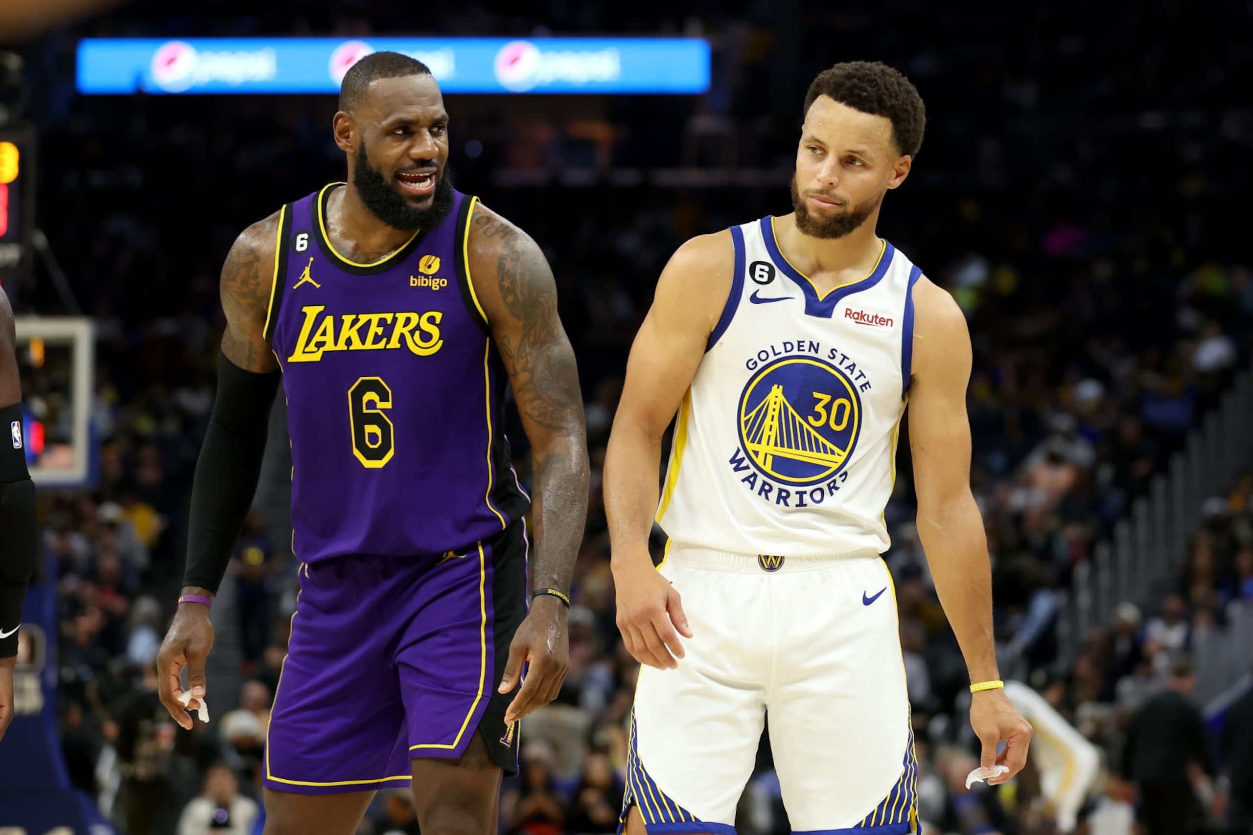 SAN FRANCISCO, CALIFORNIA - OCTOBER 18: LeBron James #6 of the Los Angeles Lakers speaks to Stephen Curry #30 of the Golden State Warriors during their game at Chase Center on October 18, 2022 in San Francisco, California. NOTE TO USER: User expressly acknowledges and agrees that, by downloading and or using this photograph, User is consenting to the terms and conditions of the Getty Images License Agreement. (Photo by Ezra Shaw/Getty Images)