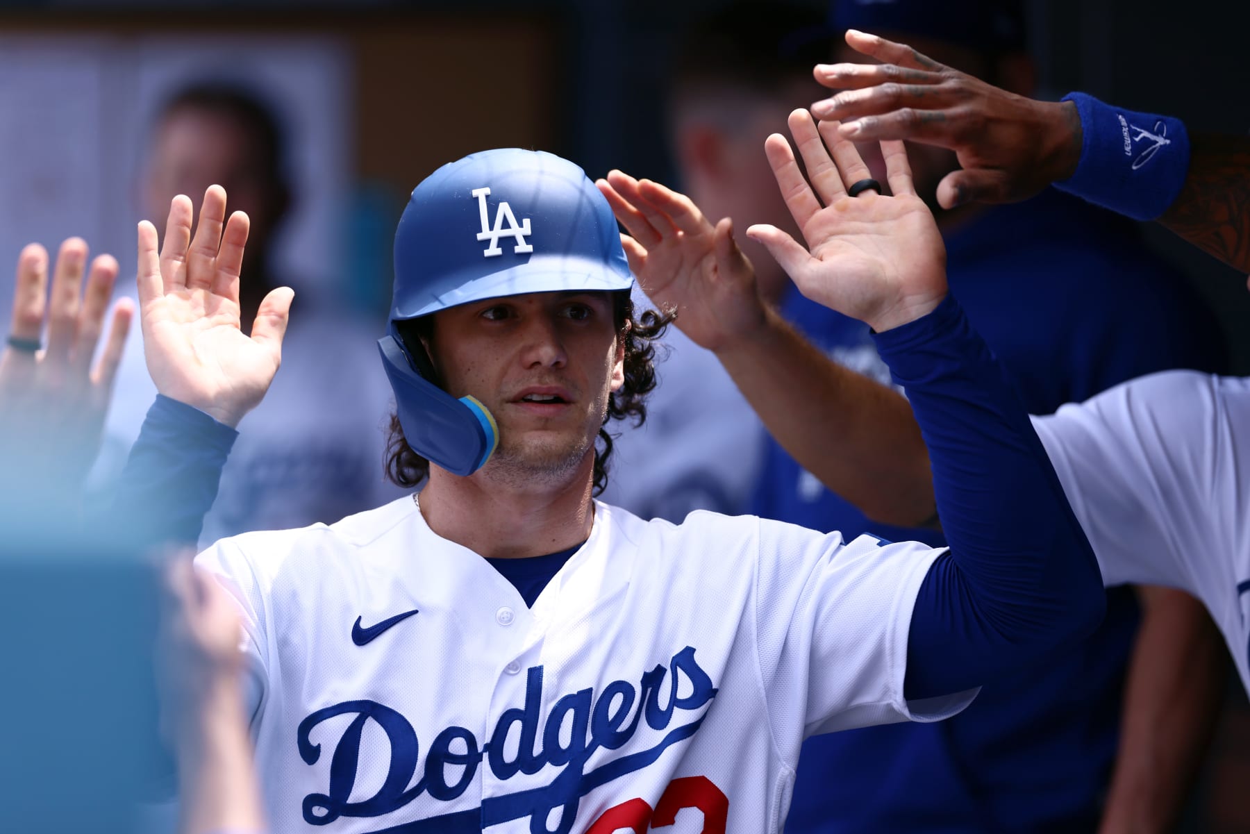 LOS ANGELES, CALIFORNIA - APRIL 30: James Outman #33 of the Los Angeles Dodgers celebrates his run scored in with teammates in the dugout during the fourth inning against the St. Louis Cardinals at Dodger Stadium on April 30, 2023 in Los Angeles, California. (Photo by Katelyn Mulcahy/Getty Images)