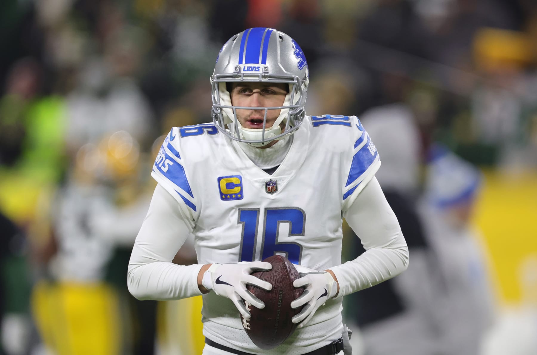 GREEN BAY, WISCONSIN - JANUARY 08: Jared Goff #16 of the Detroit Lions warms up prior to the game against the Green Bay Packers at Lambeau Field on January 08, 2023 in Green Bay, Wisconsin. (Photo by Stacy Revere/Getty Images)