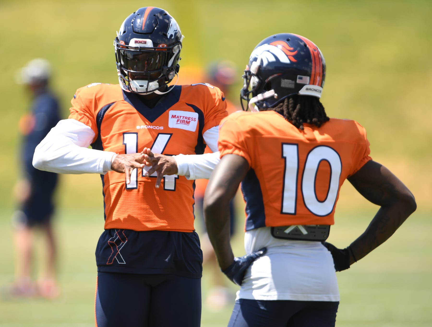 CENTENNIAL, COLORADO - AUGUST 15: Denver Broncos wide receiver Courtland Sutton (14), left, and wide receiver Jerry Jeudy (10) talk during practice, at UCHealth Training Center, on August 15, 2022 in Centennial, Colorado.(Photo by RJ Sangosti/MediaNews Group/The Denver Post via Getty Images)