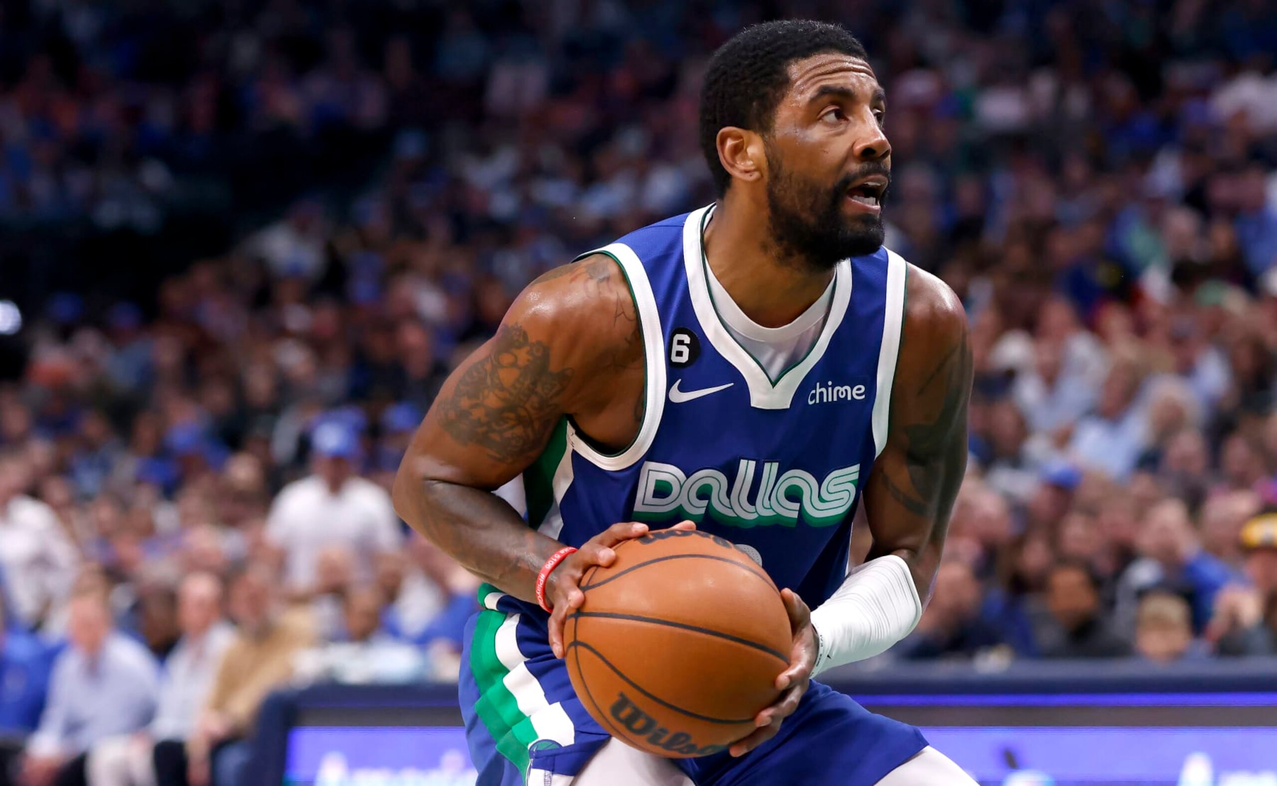 DALLAS, TX - APRIL 5: Kyrie Irving #2 of the Dallas Mavericks handles the ball against the Sacramento Kings in the second half at American Airlines Center on April 5, 2023 in Dallas, Texas. The Mavericks won 123-119. NOTE TO USER: User expressly acknowledges and agrees that, by downloading and or using this photograph, User is consenting to the terms and conditions of the Getty Images License Agreement. (Photo by Ron Jenkins/Getty Images)