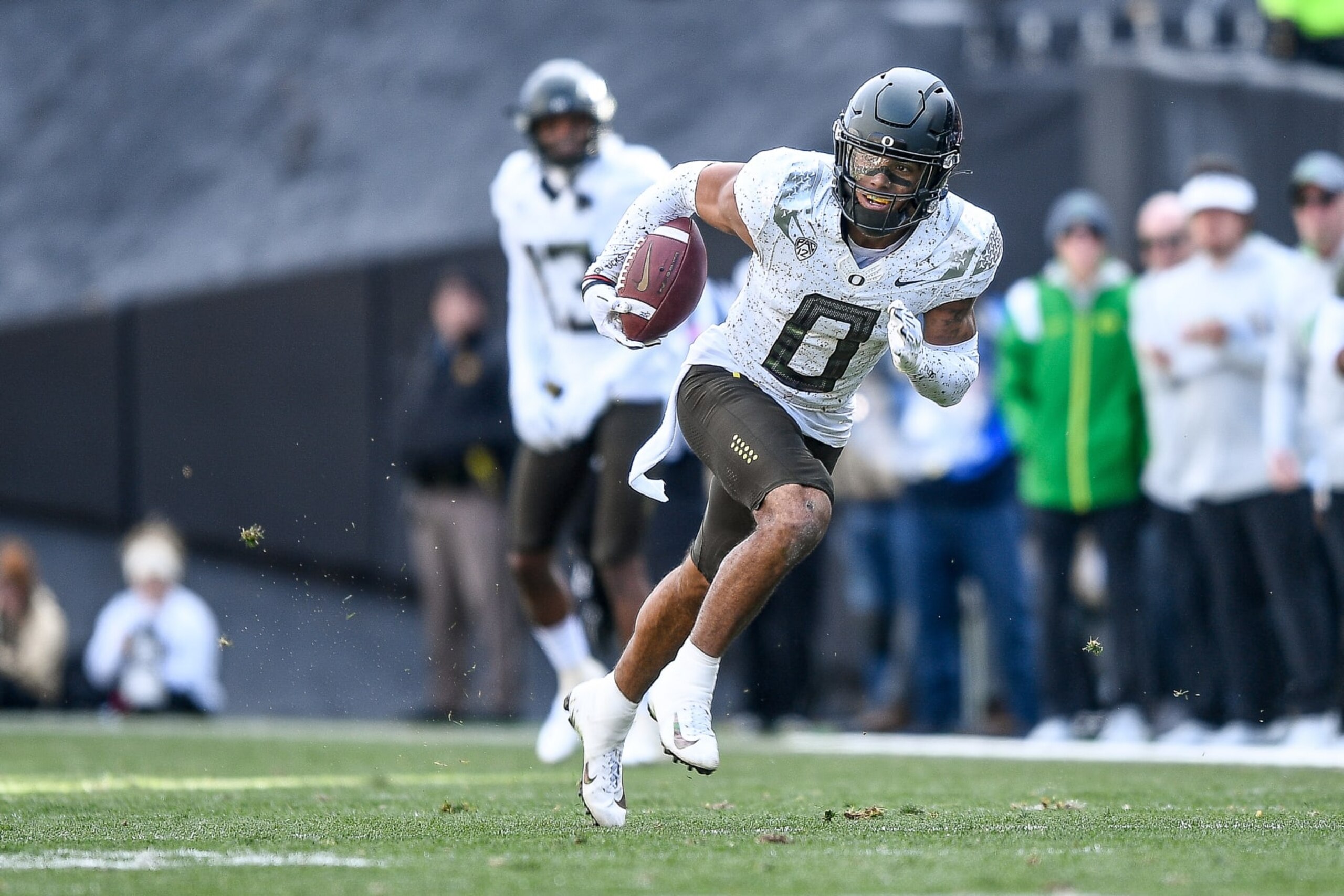 BOULDER, CO - NOVEMBER 5:  Defensive back Christian Gonzalez #0 of the Oregon Ducks returns an interception in the third quarter of a game against the Colorado Buffaloes at Folsom Field on November 5, 2022 in Boulder, Colorado. (Photo by Dustin Bradford/Getty Images)