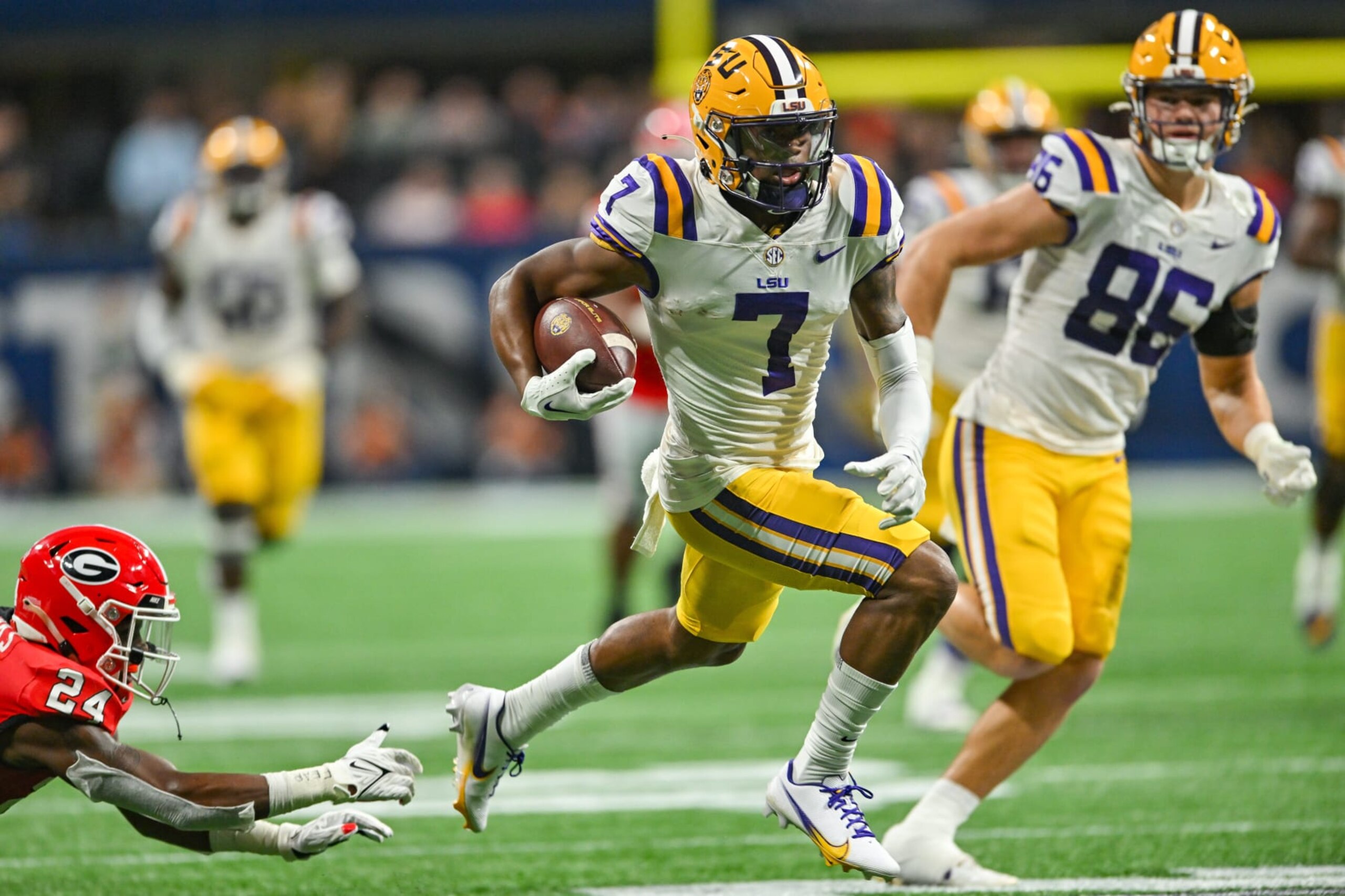 ATLANTA, GA  DECEMBER 03:  LSU wide receiver Kayshon Boutte (7) runs with the ball after a reception during the SEC Championship football game between the LSU Tigers and the Georgia Bulldogs on December 3rd, 2022 at Mercedes-Benz Stadium in Atlanta, GA.  (Photo by Rich von Biberstein/Icon Sportswire via Getty Images)