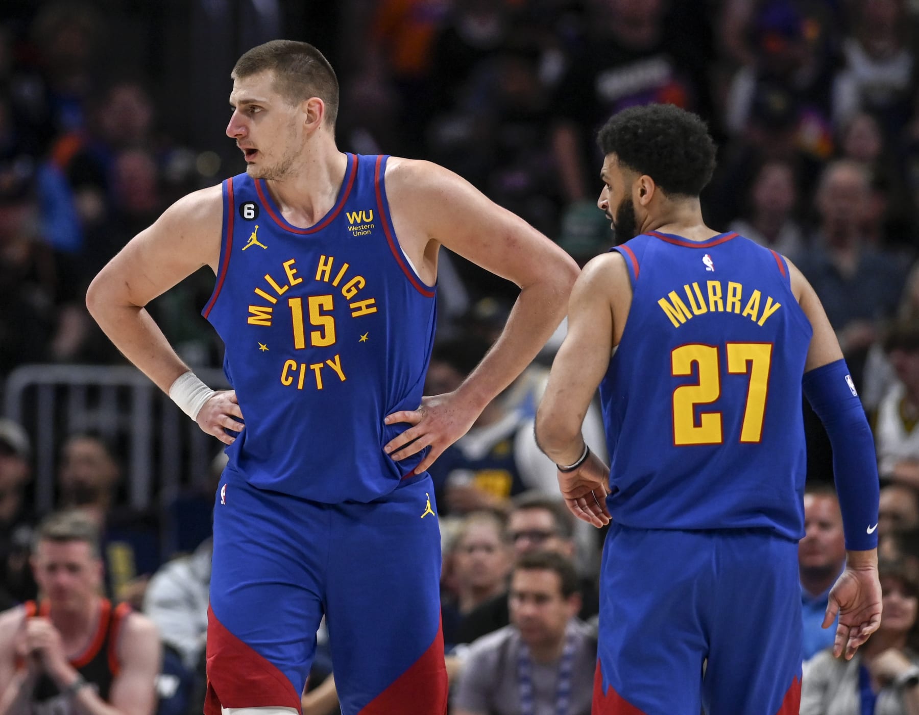 DENVER, CO - APRIL 29: Nikola Jokic (15) and Jamal Murray (27) of the Denver Nuggets loom over the Phoenix Suns during the second quarter at Ball Arena in Denver on Saturday, April 29, 2023. (Photo by AAron Ontiveroz/MediaNews Group/The Denver Post via Getty Images)