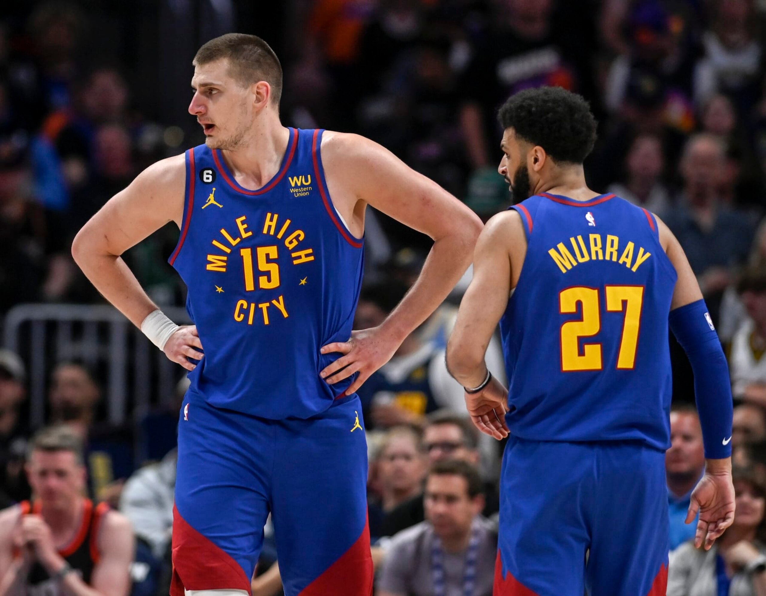 DENVER, CO - APRIL 29: Nikola Jokic (15) and Jamal Murray (27) of the Denver Nuggets loom over the Phoenix Suns during the second quarter at Ball Arena in Denver on Saturday, April 29, 2023. (Photo by AAron Ontiveroz/MediaNews Group/The Denver Post via Getty Images)