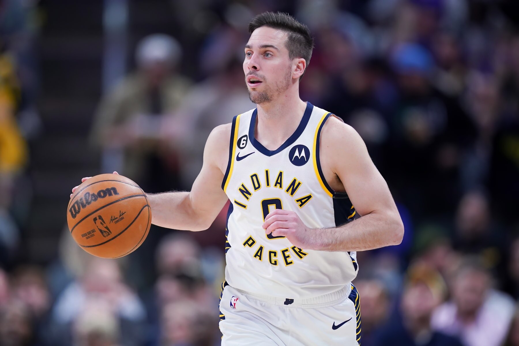 INDIANAPOLIS, INDIANA - APRIL 05: T.J. McConnell #9 of the Indiana Pacers dribbles the ball in the first quarter against the New York Knicks at Gainbridge Fieldhouse on April 05, 2023 in Indianapolis, Indiana. NOTE TO USER: User expressly acknowledges and agrees that, by downloading and or using this photograph, User is consenting to the terms and conditions of the Getty Images License Agreement. (Photo by Dylan Buell/Getty Images)