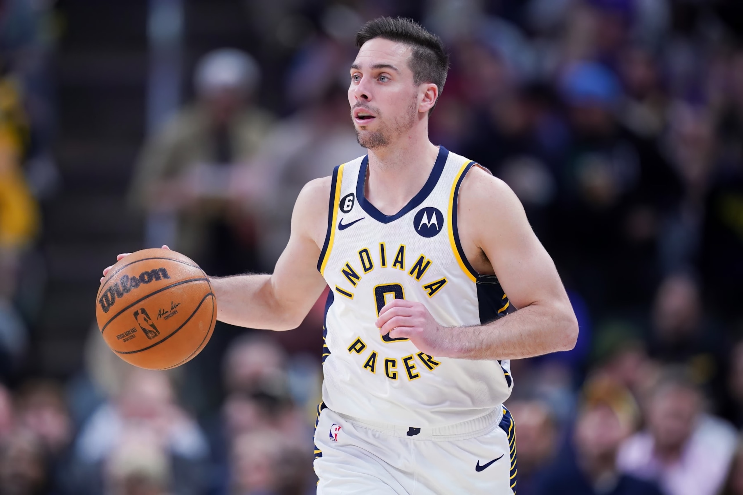 INDIANAPOLIS, INDIANA - APRIL 05: T.J. McConnell #9 of the Indiana Pacers dribbles the ball in the first quarter against the New York Knicks at Gainbridge Fieldhouse on April 05, 2023 in Indianapolis, Indiana. NOTE TO USER: User expressly acknowledges and agrees that, by downloading and or using this photograph, User is consenting to the terms and conditions of the Getty Images License Agreement. (Photo by Dylan Buell/Getty Images)
