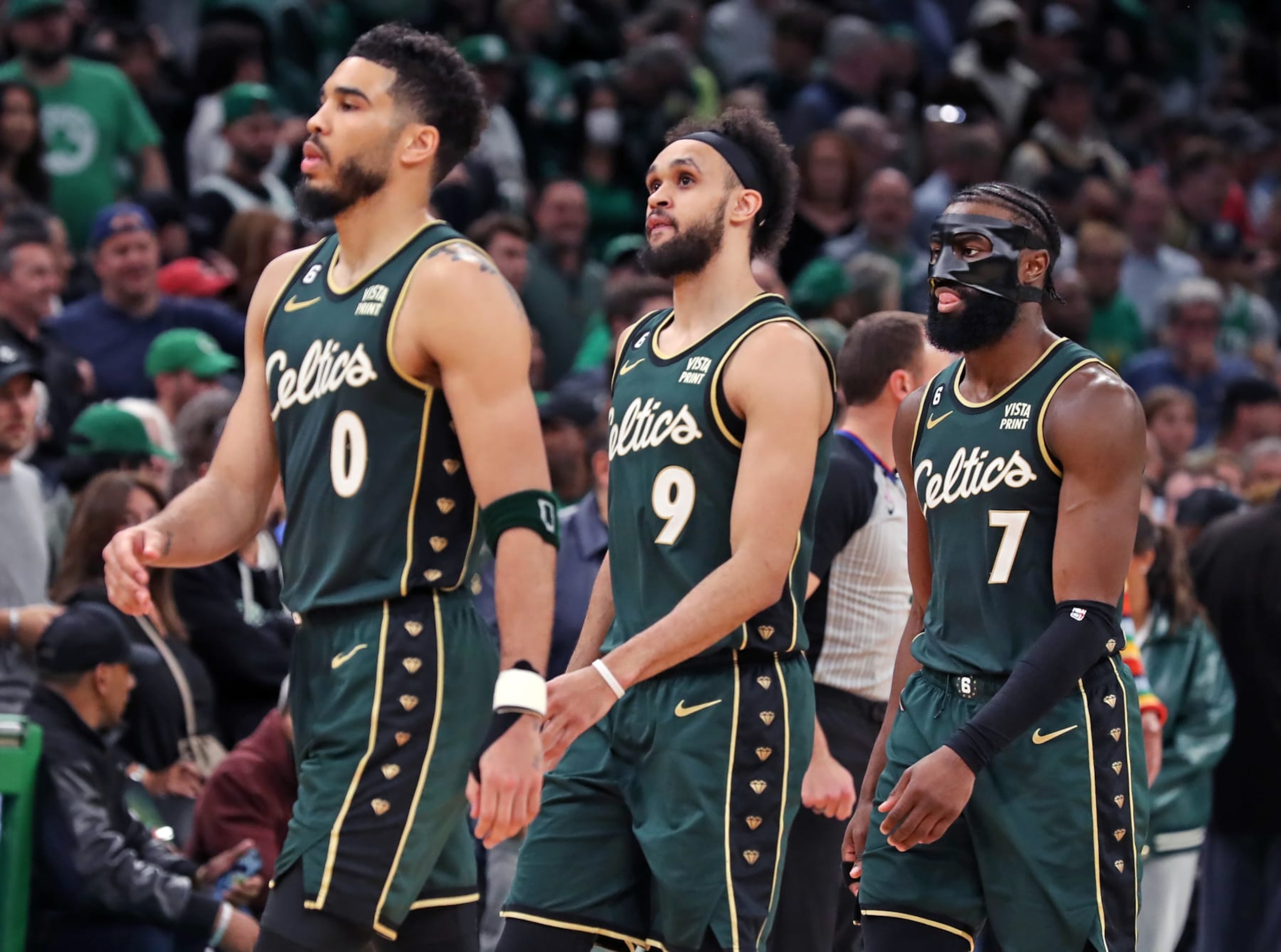 Boston, MA - April 25: From left to right, Boston Celtics Jayson Tatum, Derrick White and Jaylen Brown head to the bench for a fourth quarter timeout. The Celtics lost to the Atlanta Hawks, 119-117, in Game 5 of their Eastern Conference First Round Series. (Photo by Jim Davis/The Boston Globe via Getty Images)