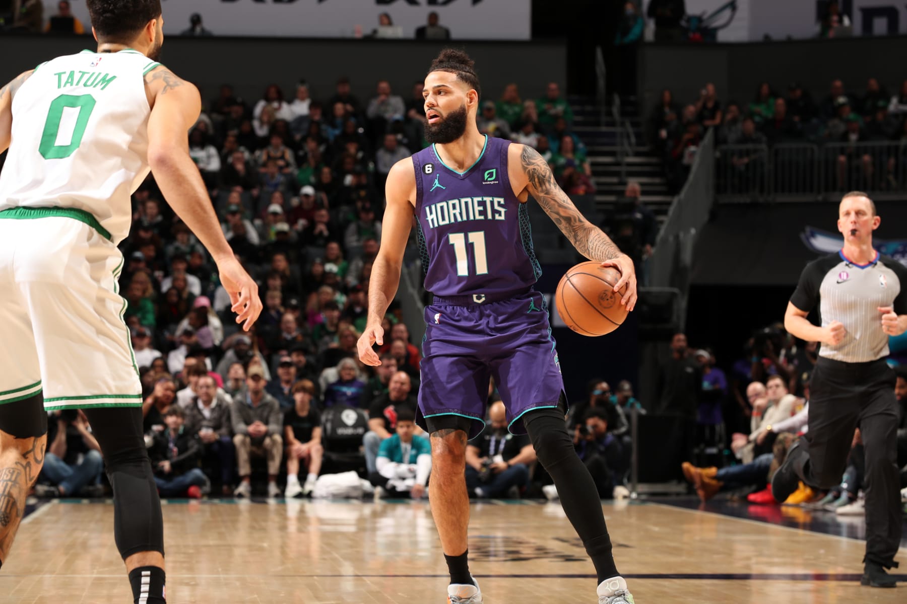 CHARLOTTE, NC - JANUARY 14: Cody Martin #11 of the Charlotte Hornets handles the ball during the game against the Boston Celtics on January 14, 2023 at Spectrum Center in Charlotte, North Carolina. NOTE TO USER: User expressly acknowledges and agrees that, by downloading and or using this photograph, User is consenting to the terms and conditions of the Getty Images License Agreement. Mandatory Copyright Notice: Copyright 2023 NBAE (Photo by Kent Smith/NBAE via Getty Images)