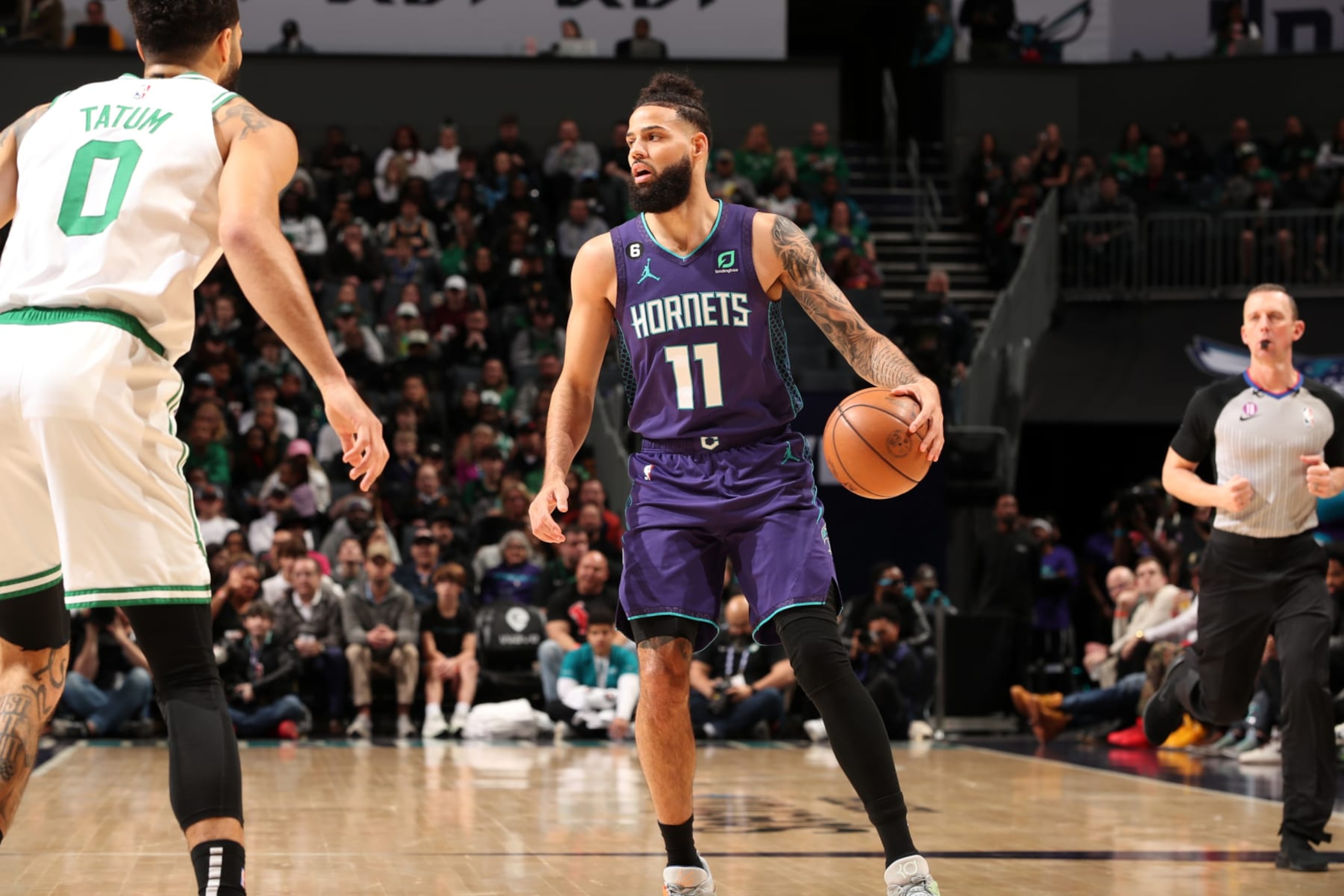 CHARLOTTE, NC - JANUARY 14: Cody Martin #11 of the Charlotte Hornets handles the ball during the game against the Boston Celtics on January 14, 2023 at Spectrum Center in Charlotte, North Carolina. NOTE TO USER: User expressly acknowledges and agrees that, by downloading and or using this photograph, User is consenting to the terms and conditions of the Getty Images License Agreement. Mandatory Copyright Notice: Copyright 2023 NBAE (Photo by Kent Smith/NBAE via Getty Images)