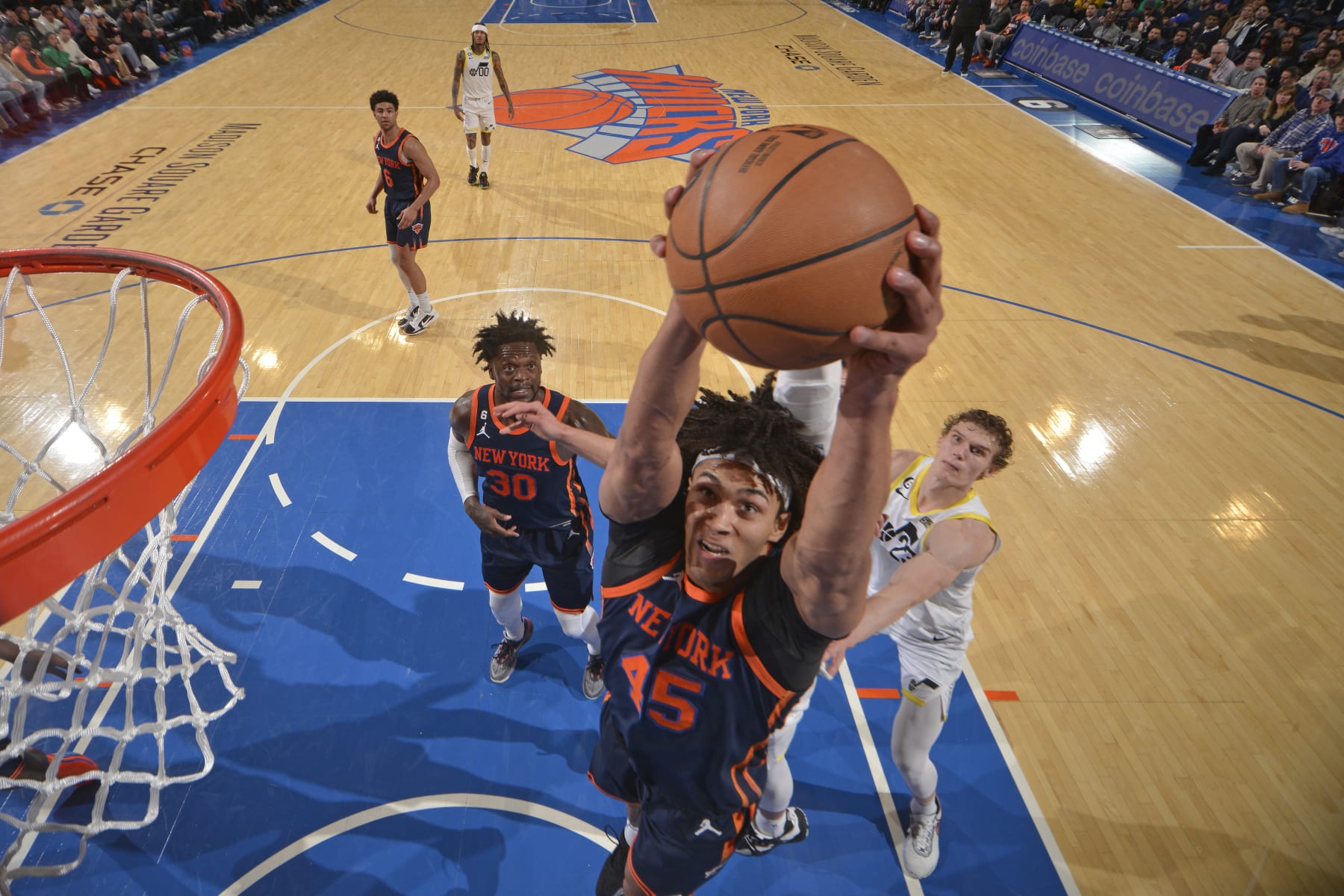 NEW YORK, NY - FEBRUARY 11: Jericho Sims #45 of the New York Knicks grabs the rebound during the game on February 11, 2023 at Madison Square Garden in New York City, New York.  NOTE TO USER: User expressly acknowledges and agrees that, by downloading and or using this photograph, User is consenting to the terms and conditions of the Getty Images License Agreement. Mandatory Copyright Notice: Copyright 2023 NBAE  (Photo by Jesse D. Garrabrant/NBAE via Getty Images)