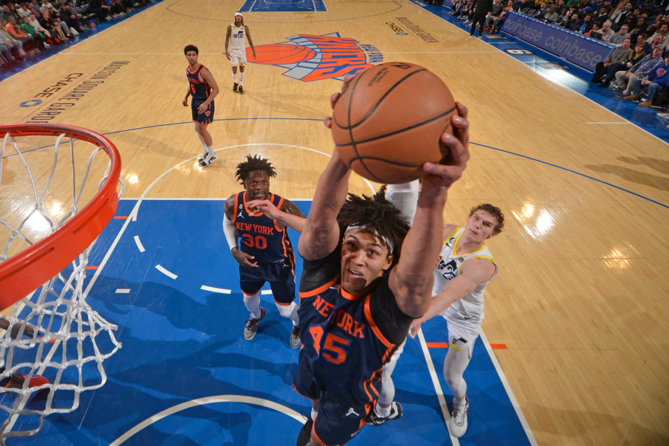 NEW YORK, NY - FEBRUARY 11: Jericho Sims #45 of the New York Knicks grabs the rebound during the game on February 11, 2023 at Madison Square Garden in New York City, New York.  NOTE TO USER: User expressly acknowledges and agrees that, by downloading and or using this photograph, User is consenting to the terms and conditions of the Getty Images License Agreement. Mandatory Copyright Notice: Copyright 2023 NBAE  (Photo by Jesse D. Garrabrant/NBAE via Getty Images)