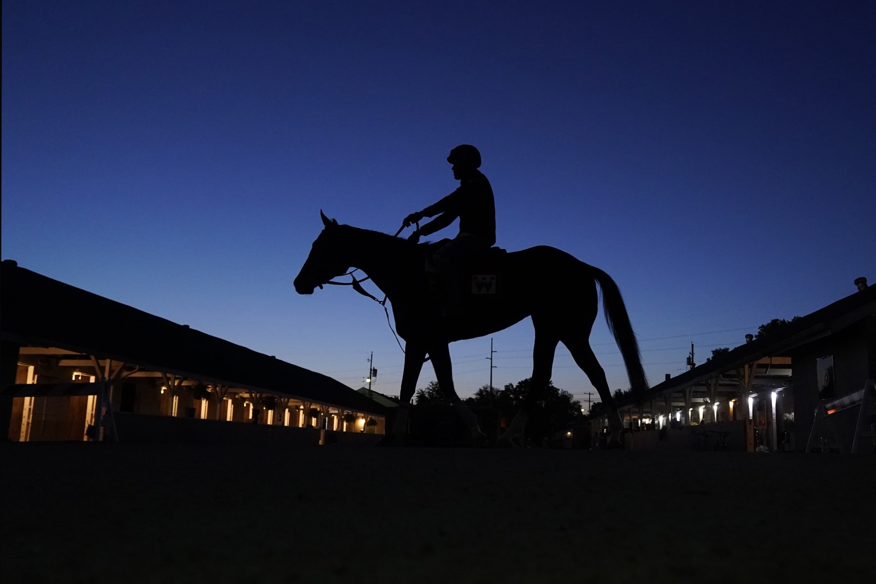 A horse is ridden to the track for an early-morning workout at Churchill Downs Tuesday, May 2, 2023, in Louisville, Ky. The 149th running of the Kentucky Derby is scheduled for Saturday, May 6. (AP Photo/Charlie Riedel)