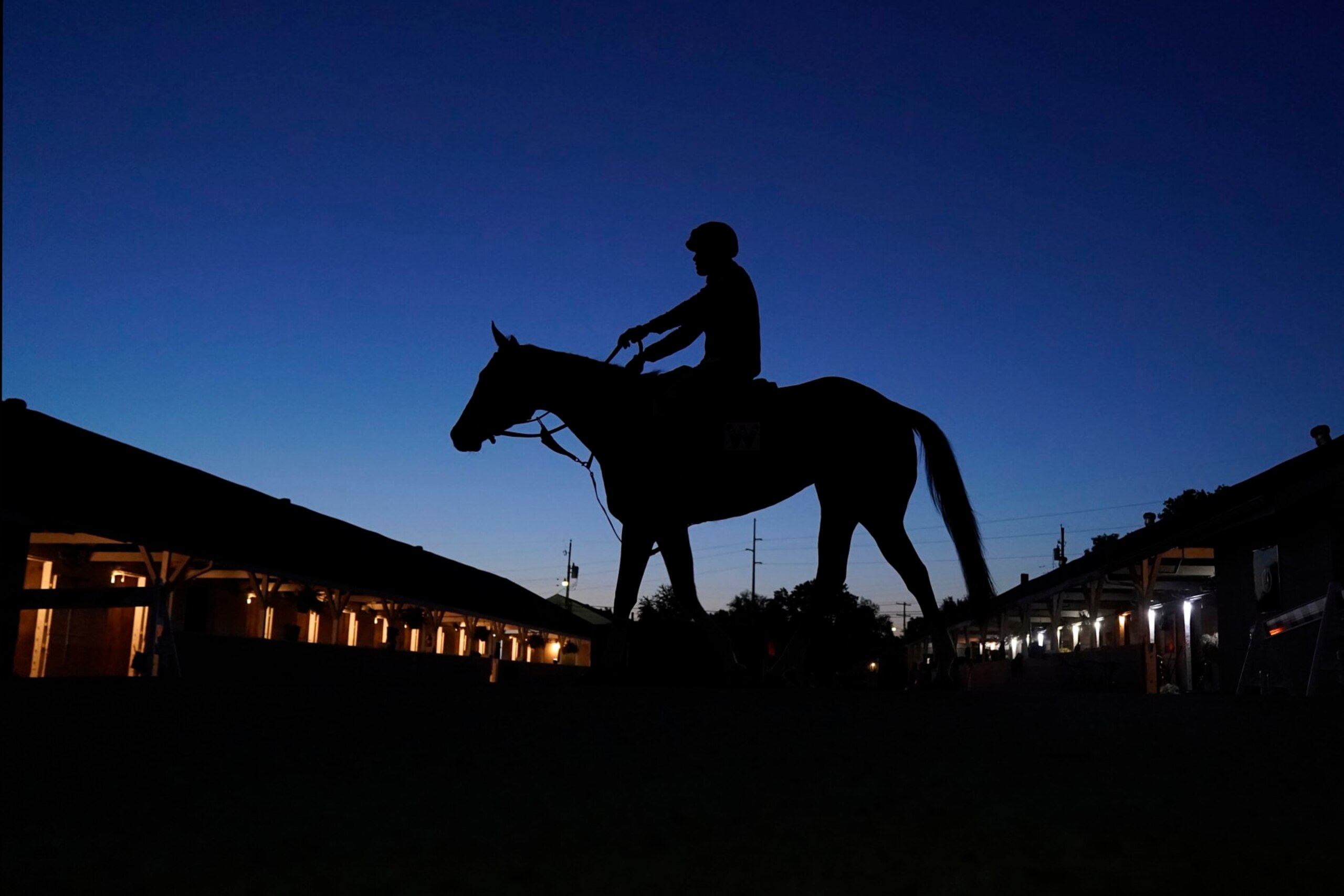 A horse is ridden to the track for an early-morning workout at Churchill Downs Tuesday, May 2, 2023, in Louisville, Ky. The 149th running of the Kentucky Derby is scheduled for Saturday, May 6. (AP Photo/Charlie Riedel)