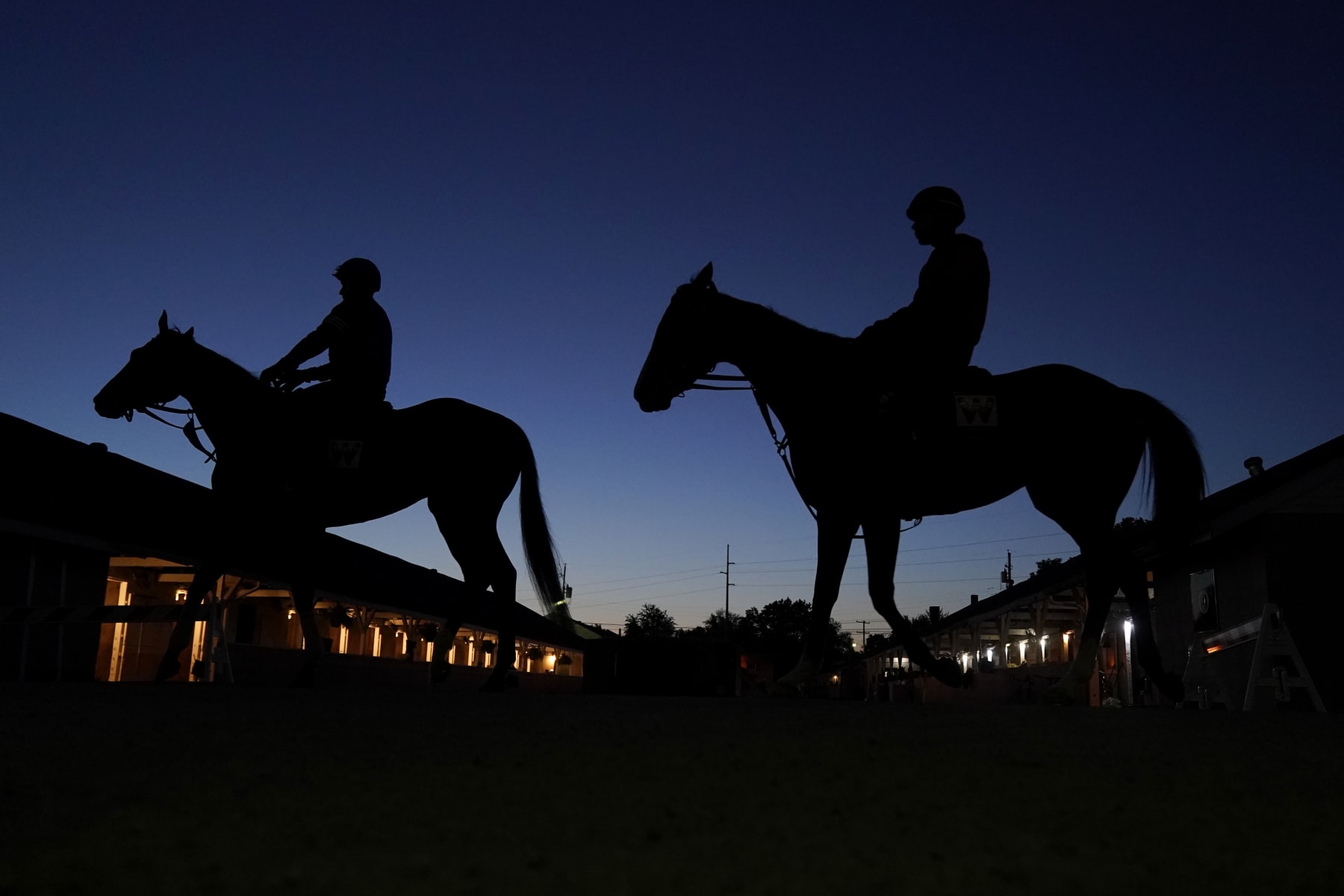Horses head for the track for an early-morning workout at Churchill Downs Tuesday, May 2, 2023, in Louisville, Ky. The 149th running of the Kentucky Derby is scheduled for Saturday, May 6. (AP Photo/Charlie Riedel)