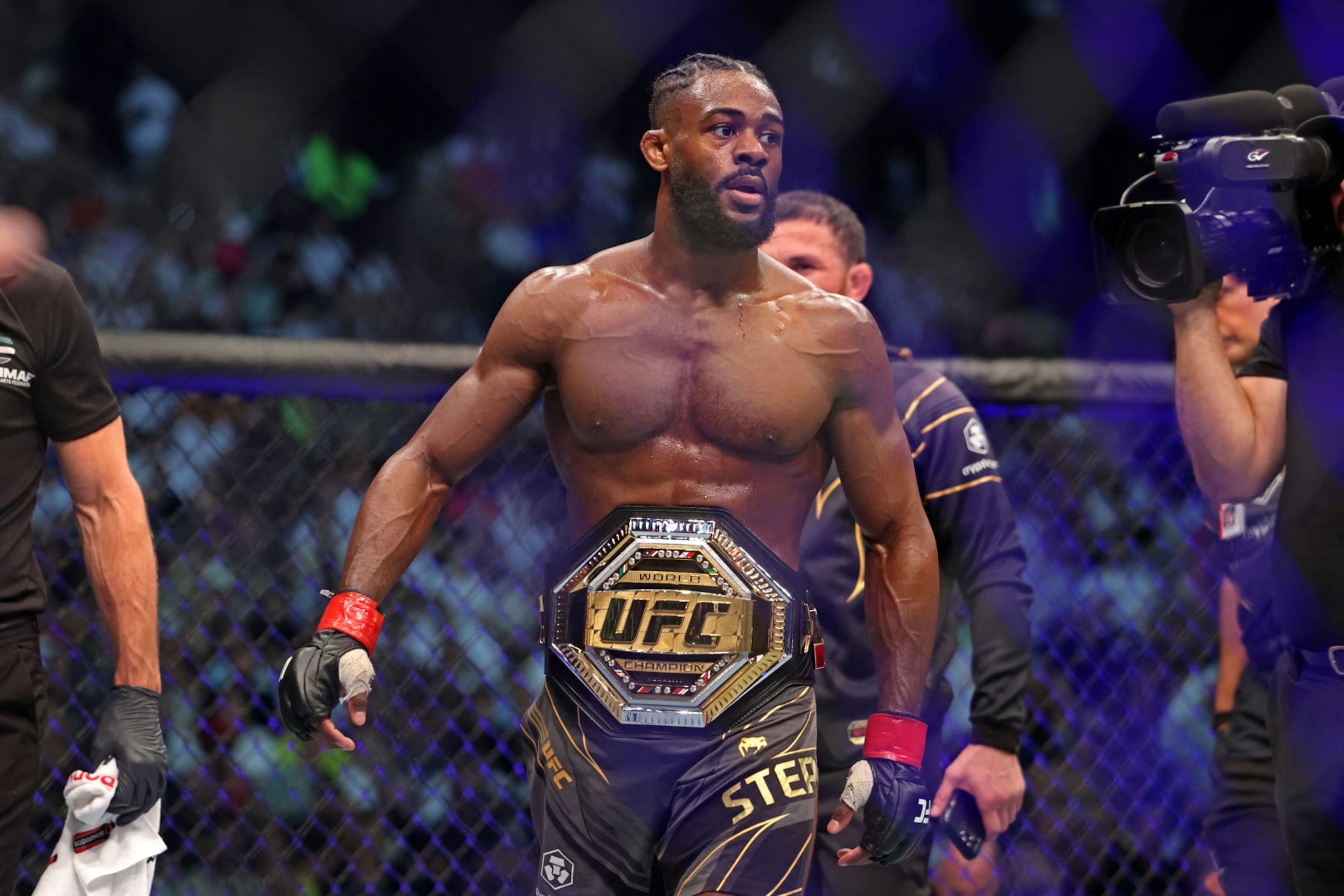 Aljamain Sterling wears the title belt after defeating TJ Dillashaw in the bantamweight championship at the Ultimate Fighting Championship (UFC) event at the Etihad Arena in Abu Dhabi on October 22, 2022. (Photo by Giuseppe CACACE / AFP) (Photo by GIUSEPPE CACACE/AFP via Getty Images) Aljamain Sterling wears the title belt after defeating TJ Dillashaw in the bantamweight championship at the Ultimate Fighting Championship (UFC) event at the Etihad Arena in Abu Dhabi on October 22, 2022. (Photo by Giuseppe CACACE / AFP) (Photo by GIUSEPPE CACACE/AFP via Getty Images)