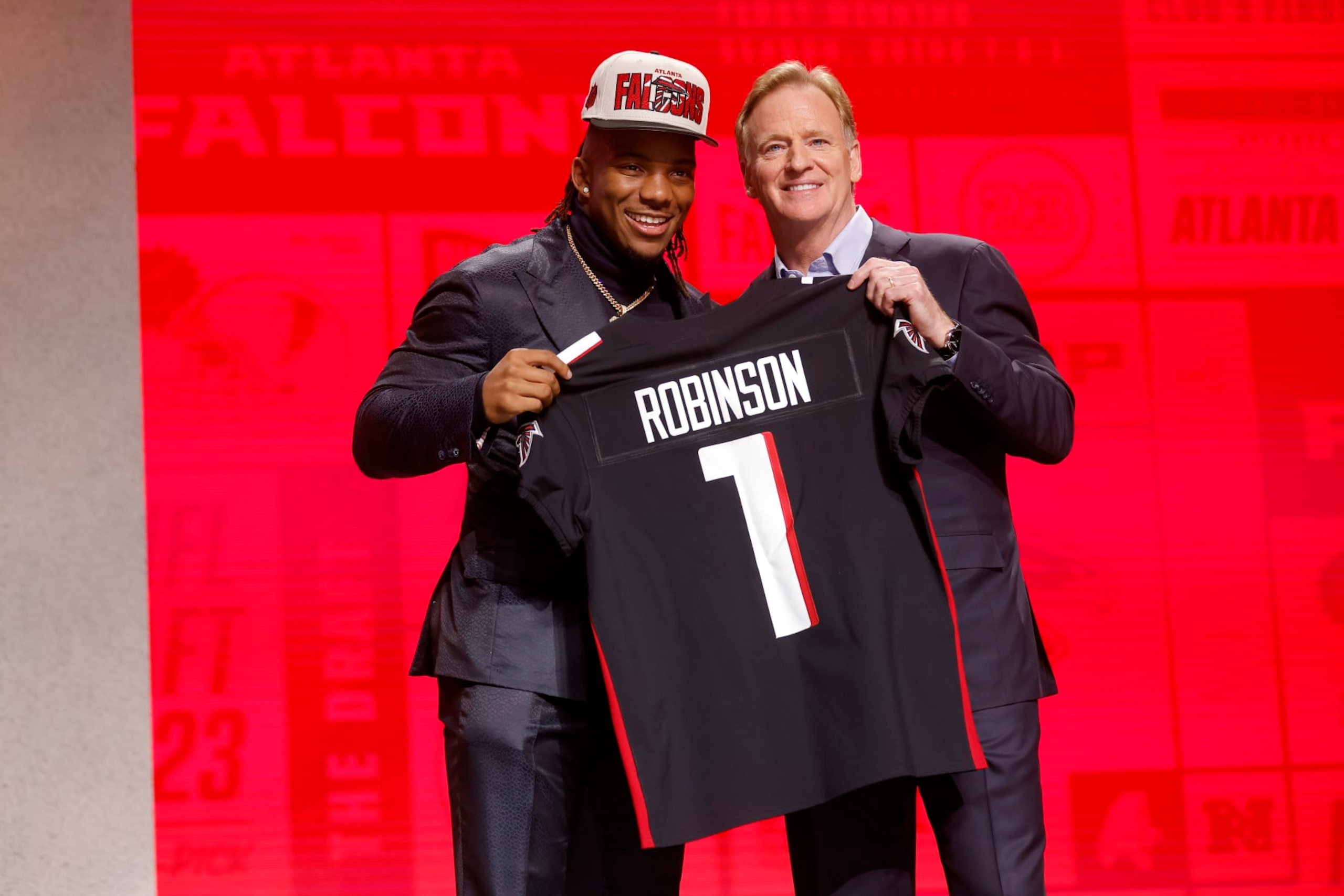 KANSAS CITY, MISSOURI - APRIL 27: (L-R) Bijan Robinson poses with NFL Commissioner Roger Goodell after being selected eight overall by the Atlanta Falcons during the first round of the 2023 NFL Draft at Union Station on April 27, 2023 in Kansas City, Missouri. (Photo by David Eulitt/Getty Images)